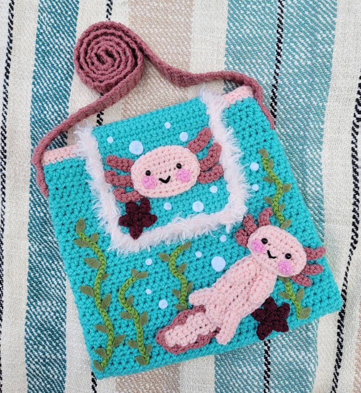 Crocheted bag with axolotl design and plants
