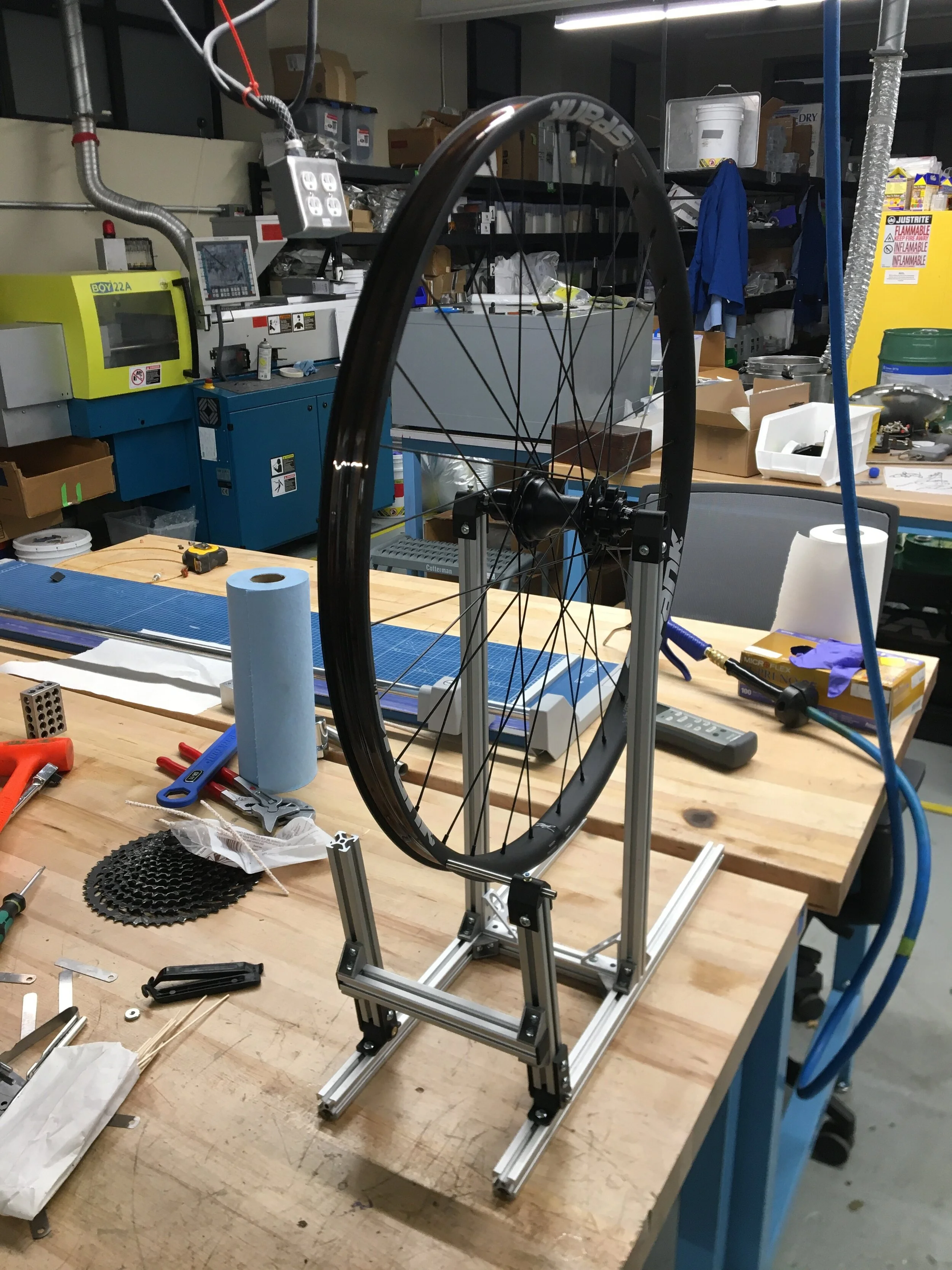 Made a simple wheel truing stand for bikes. So simple but effective. Future design(s) will incorporate two-sided truing abilities and maybe a built-in dishing tool.