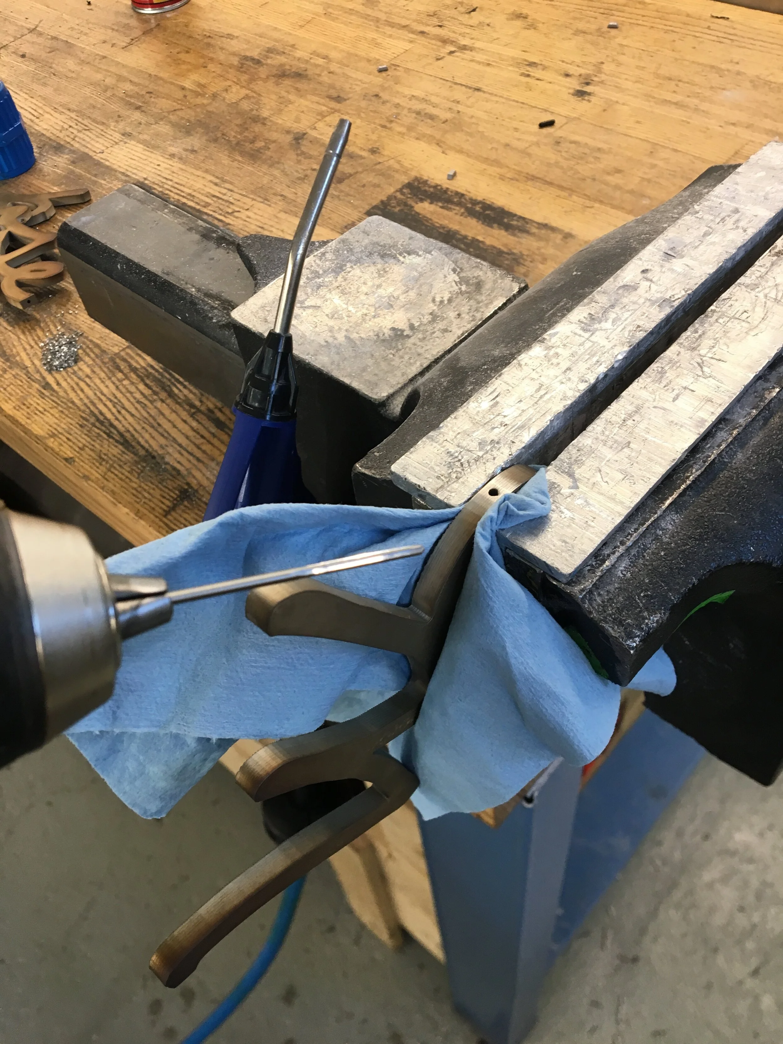 Reaming out the holes for dowel pins.