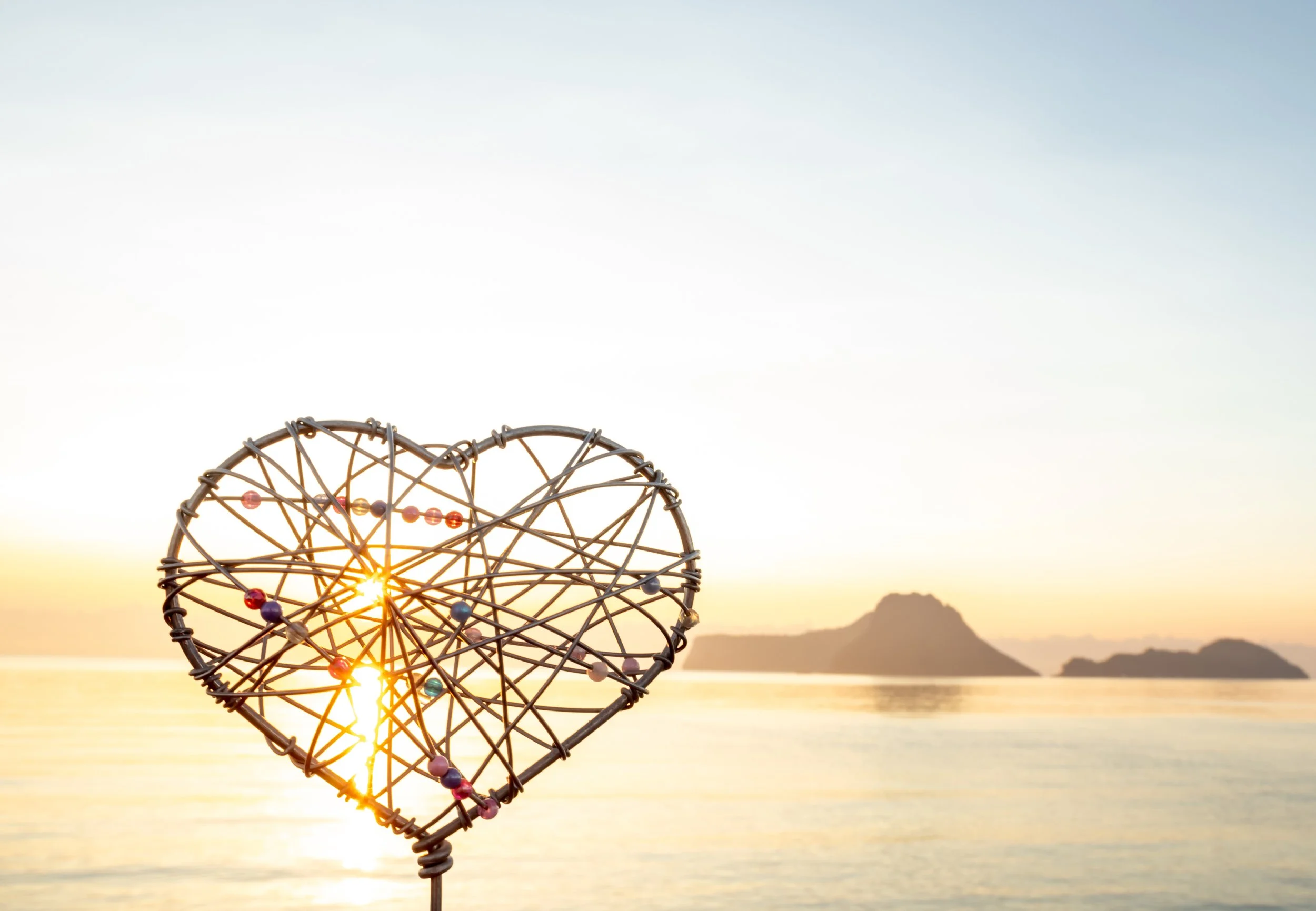 heart design with sunset background