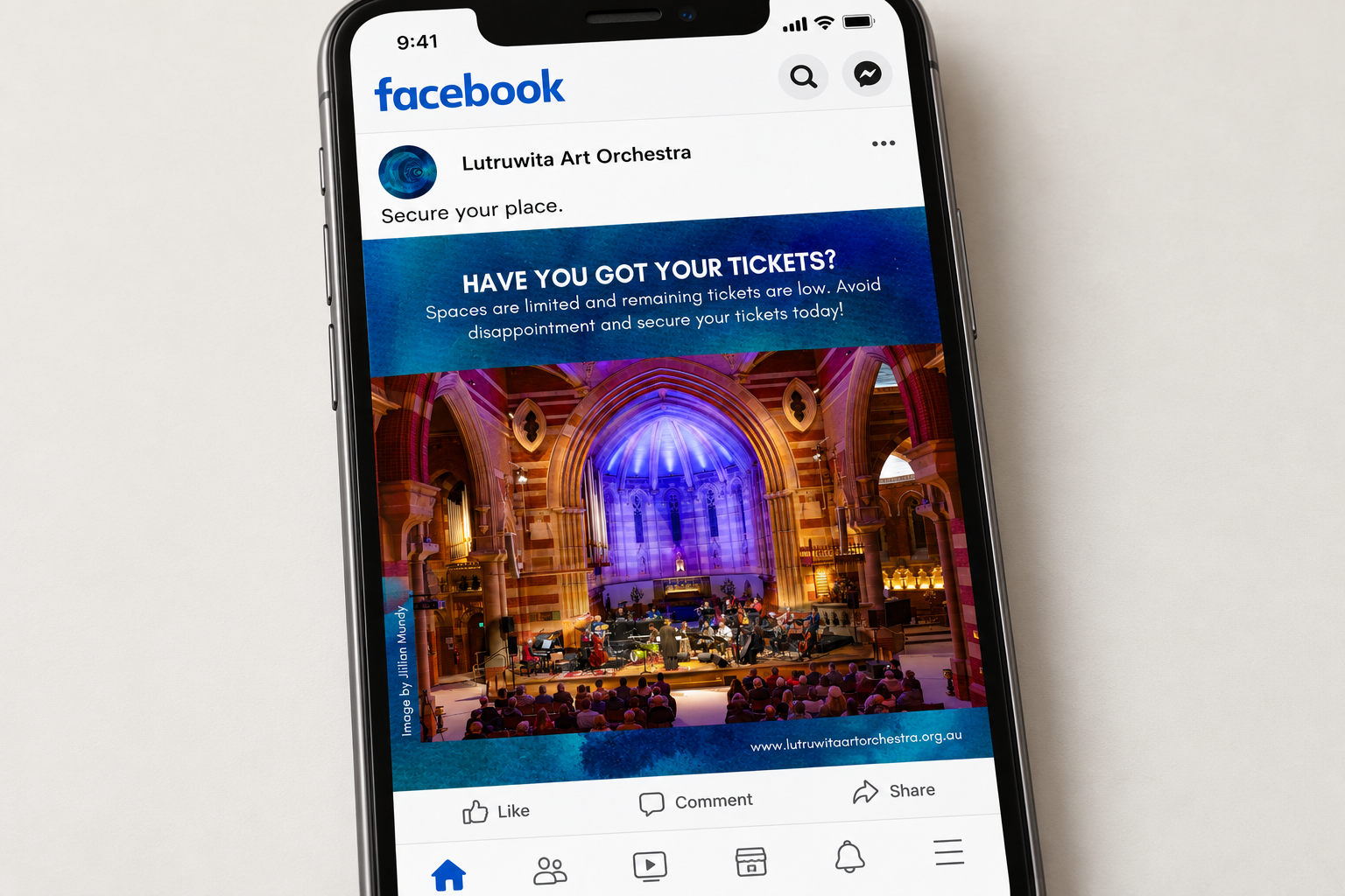 Facebook mock-up showing a Lutruwita Art Orchestra ticket reminder with blue watercolour branding and a concert photograph.