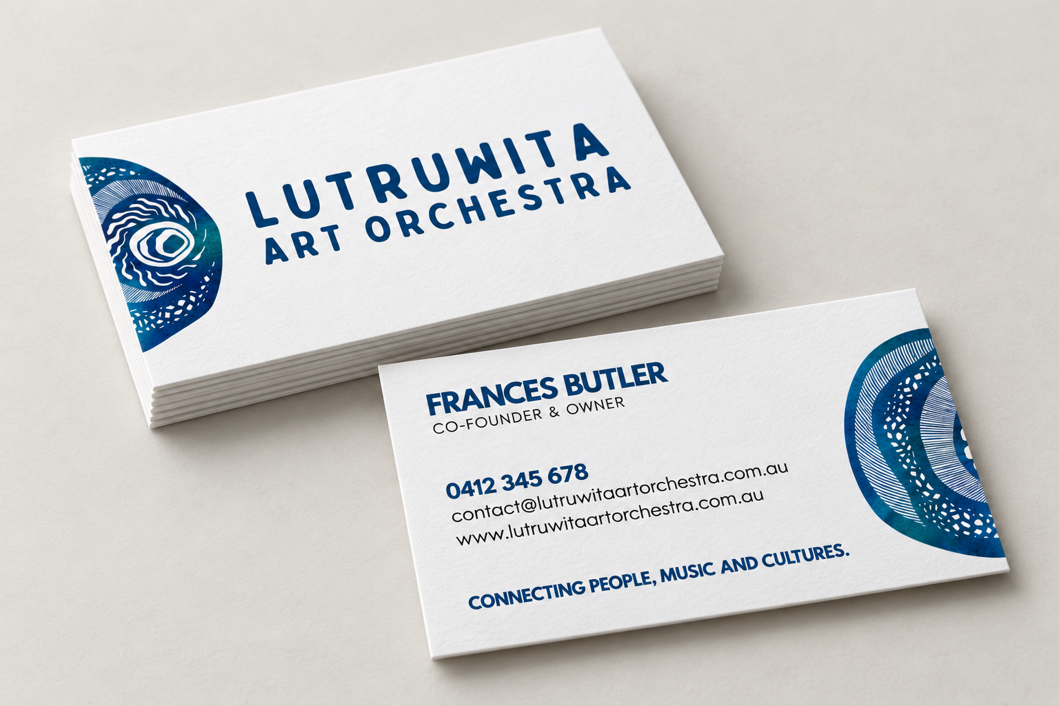 Business card mock-up for Lutruwita Art Orchestra, showing the artwork logo, navy typography and contact layout.