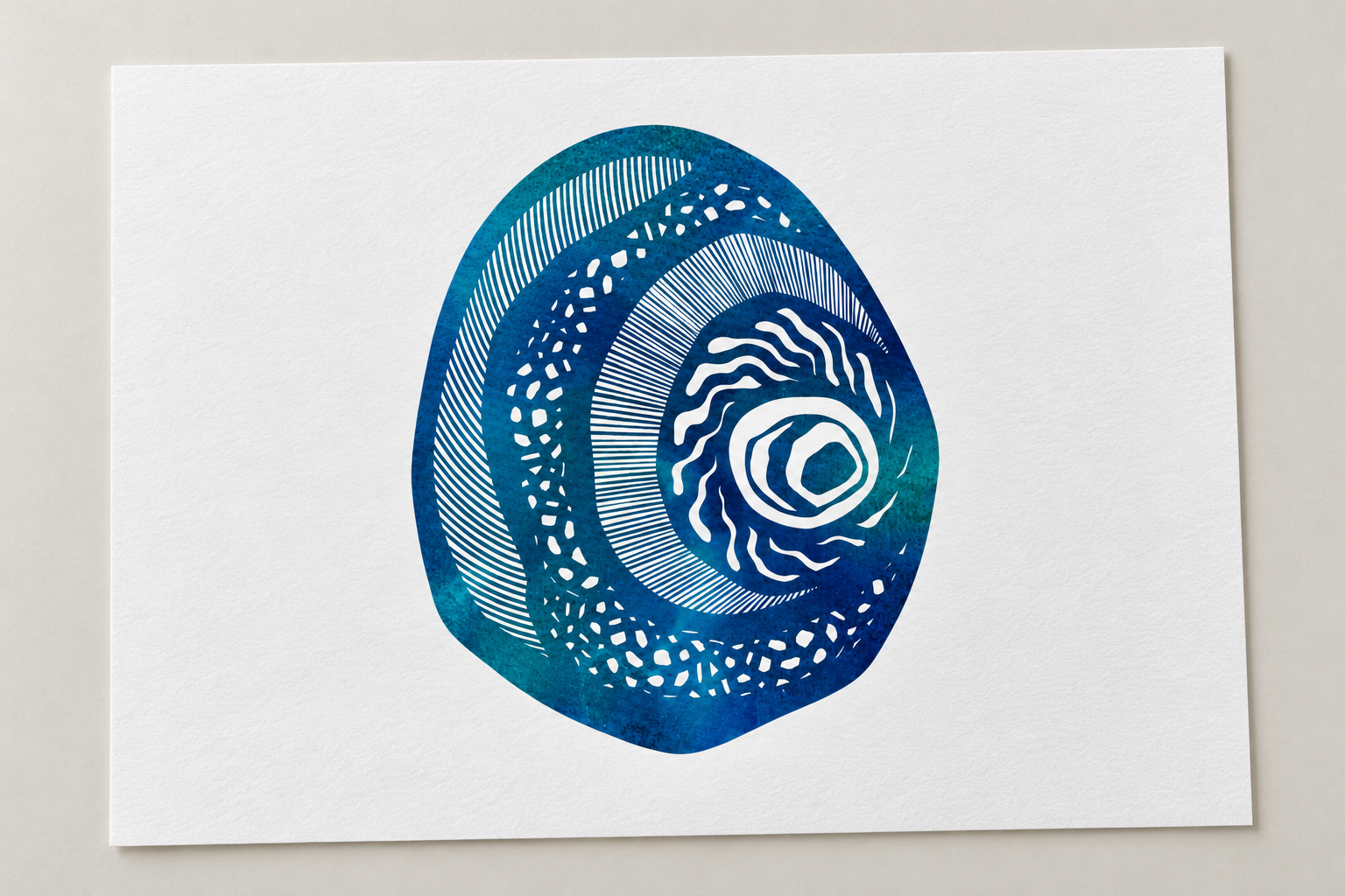 Mock-up of Lutruwita Art Orchestra’s blue and teal artwork with flowing white linework on textured white paper.