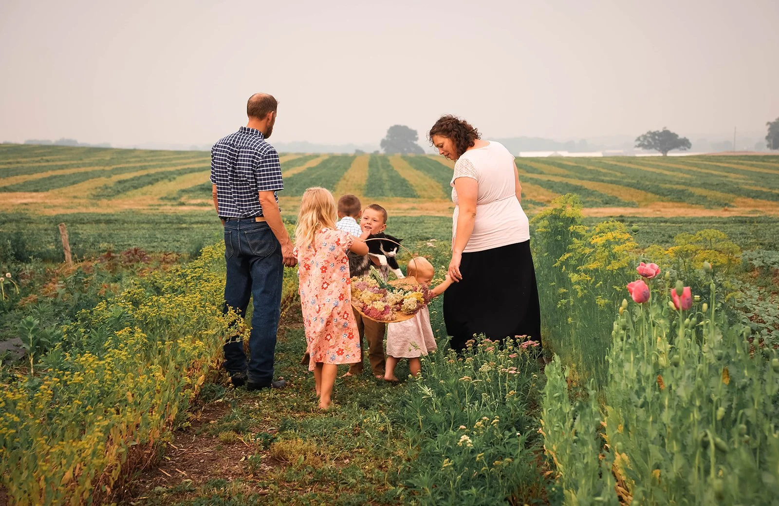 flower farm Michigan - family of farmers walking in the field