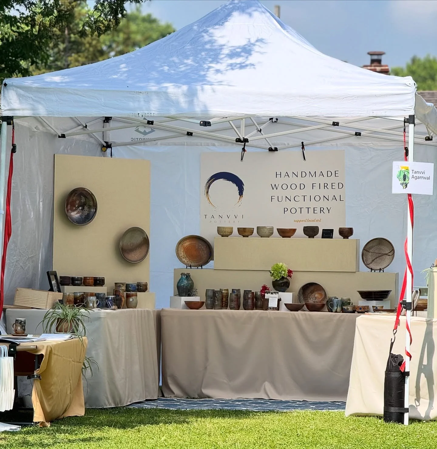 While most of the tour weekend was gorgeous, Sunday afternoon brought some wicked winds, especially to the west end of the tour. We were all heartbroken to hear that Tanvvi Agarrwal had a sign blow off her tent frame. It knocked over a number of her 