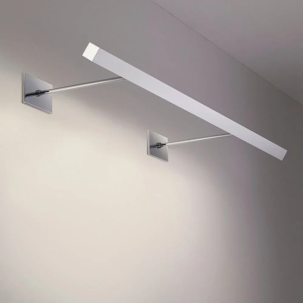 Modernist long linear sconce illuminating wall below