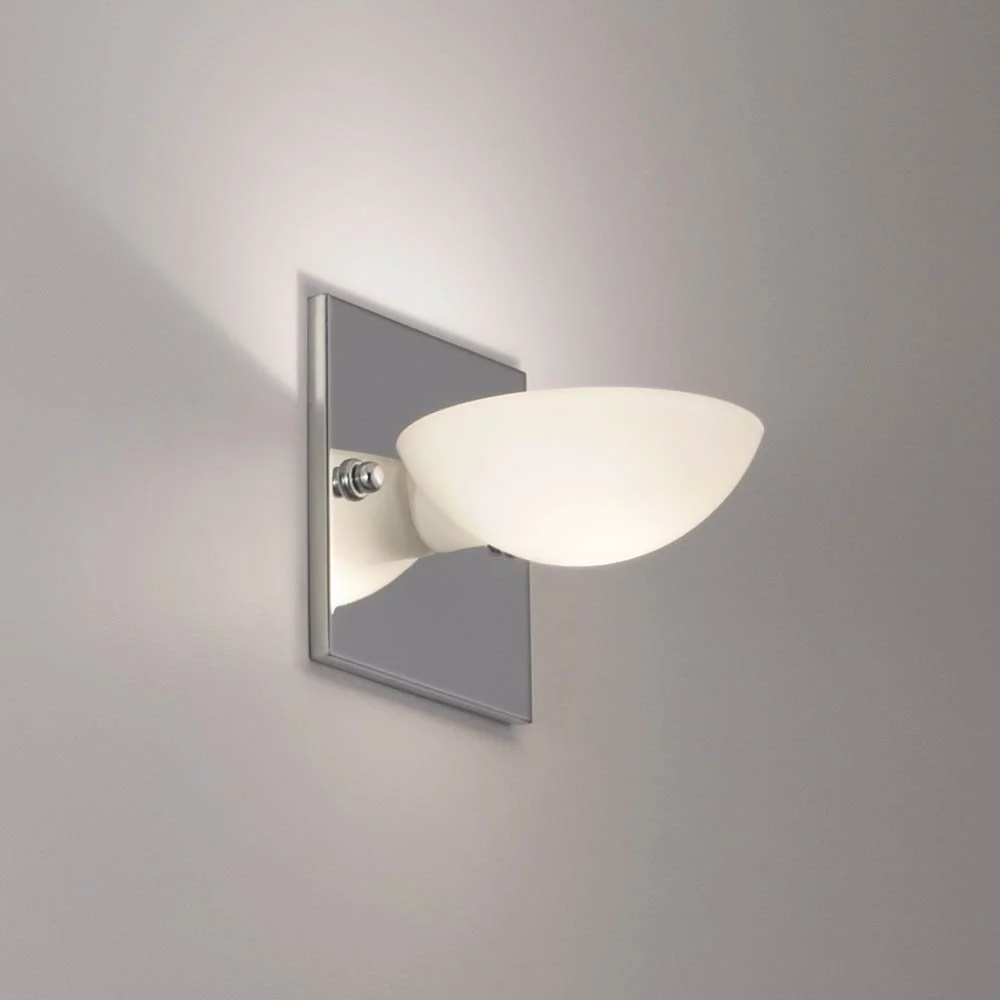 seashell shaped glass sconce on a polished chrome square mounting plate