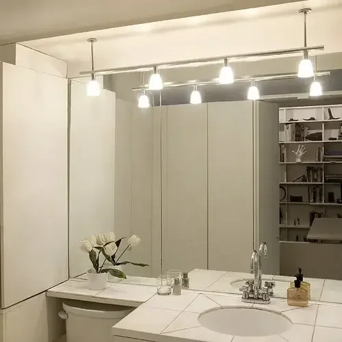 modern bath light in front of mirror