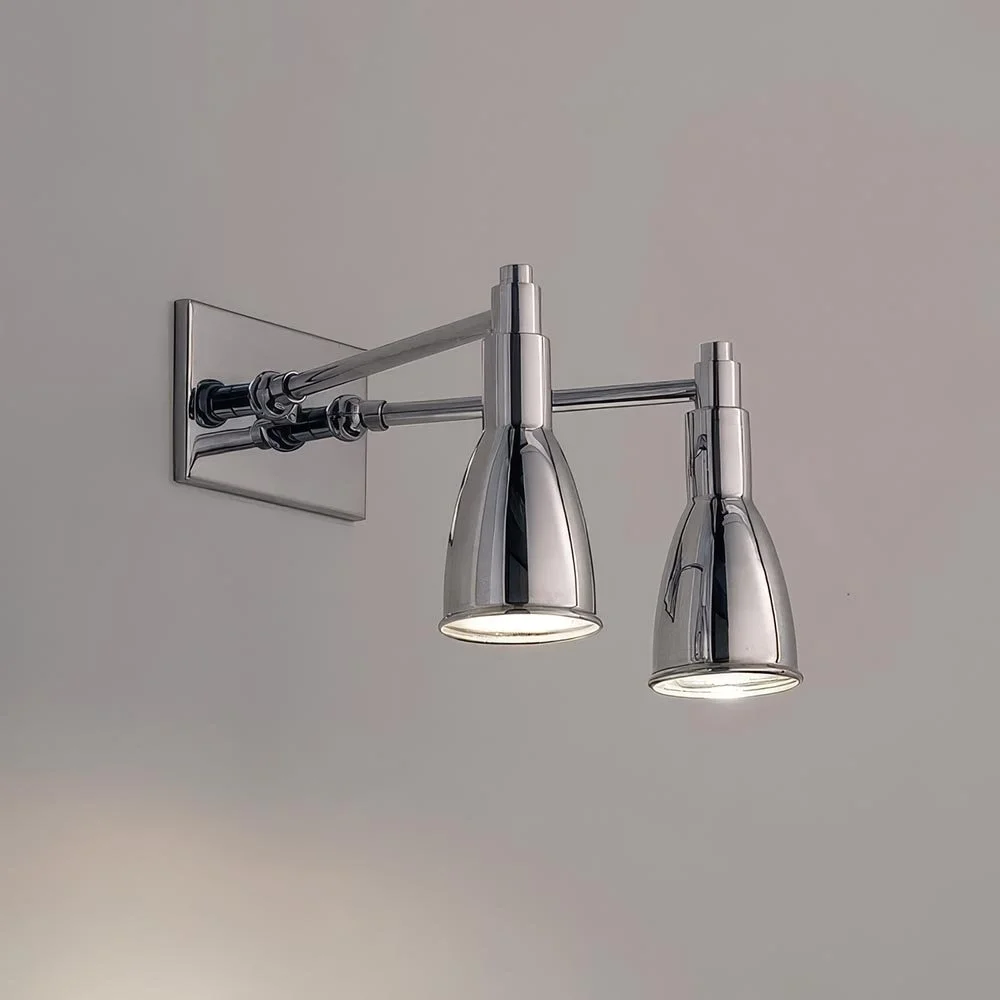 two downward spot light luminaries on angled stems projecting from a horizontal rectangular mounting plate