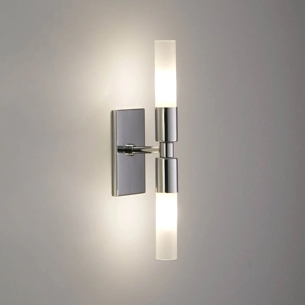 dual cylindrical glass on either end of a central stem coming out of a vertical rectangular mounting plate with no screws visible