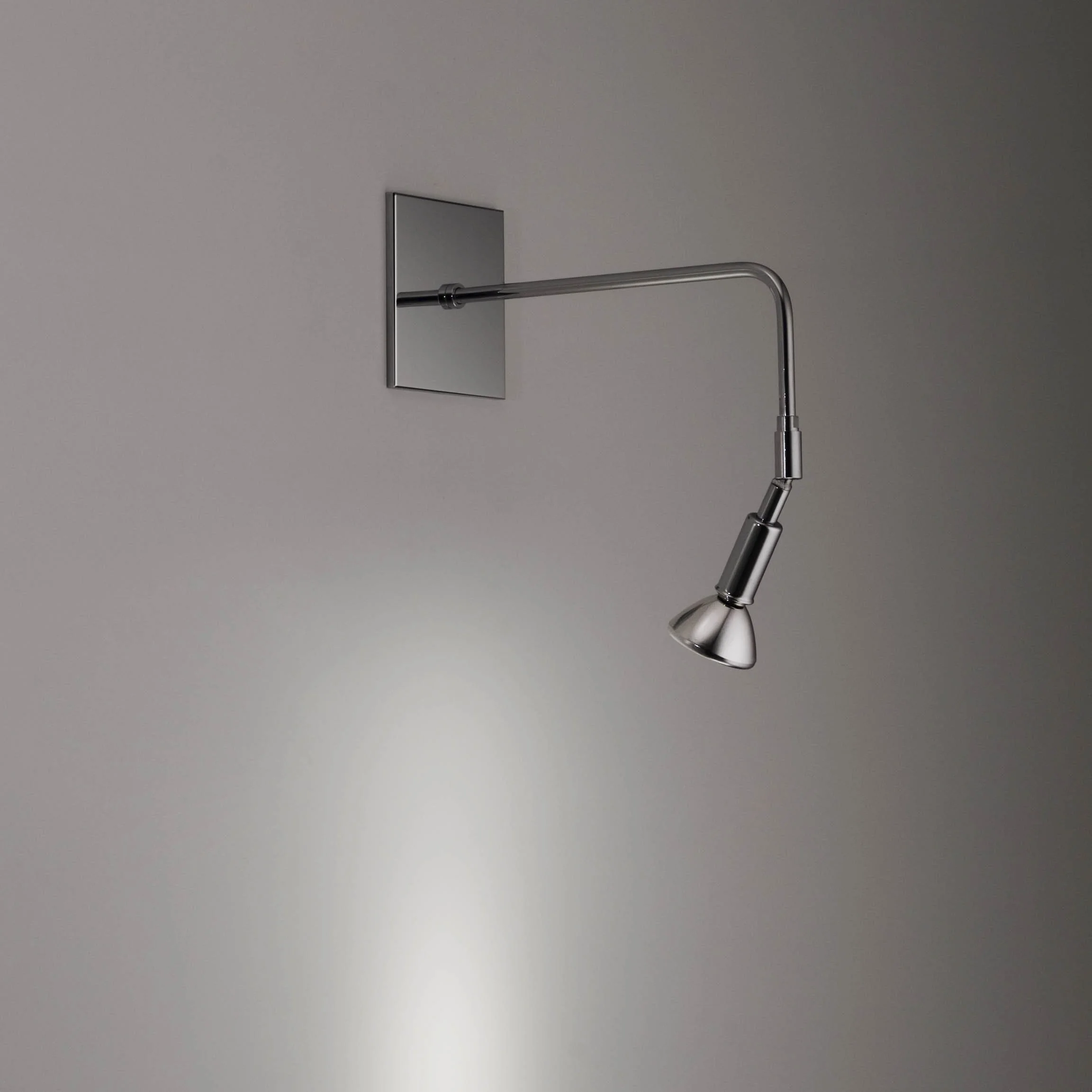 polished chrome spot light sconce with a square mounting plate