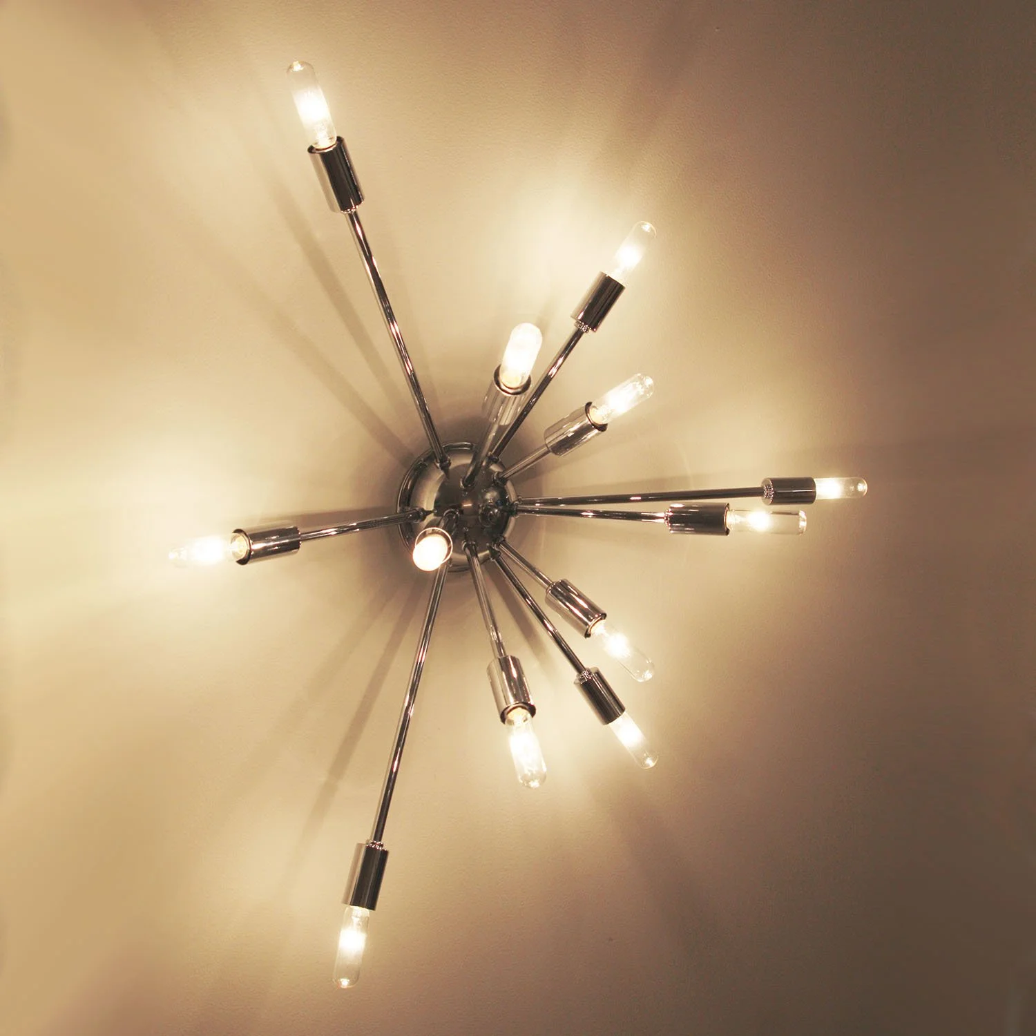 a mid-century polished chrome sconce like the classic Sputnik chandelier but in half form on the wall
