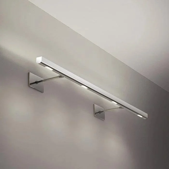 long linear sconce with ambient uplighting and accent down lighting