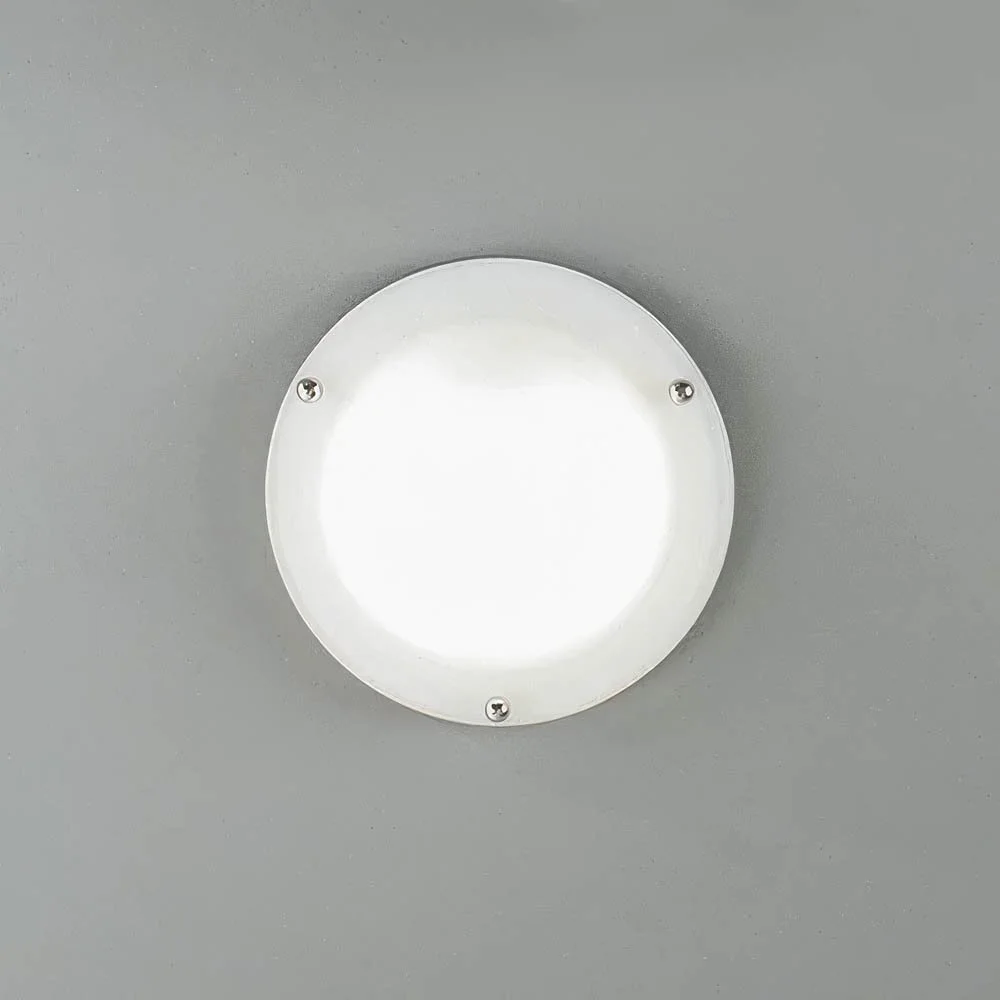 a circular glass sconce with three little spherical connecting nuts in polished chrome