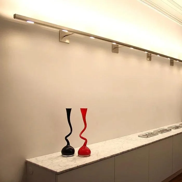 long contemporary linear sconce with bright up lighting and accent down lighting