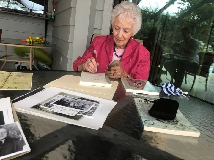 Betty Grebenschikoff signing copies of Once My Name Was Sara at her home