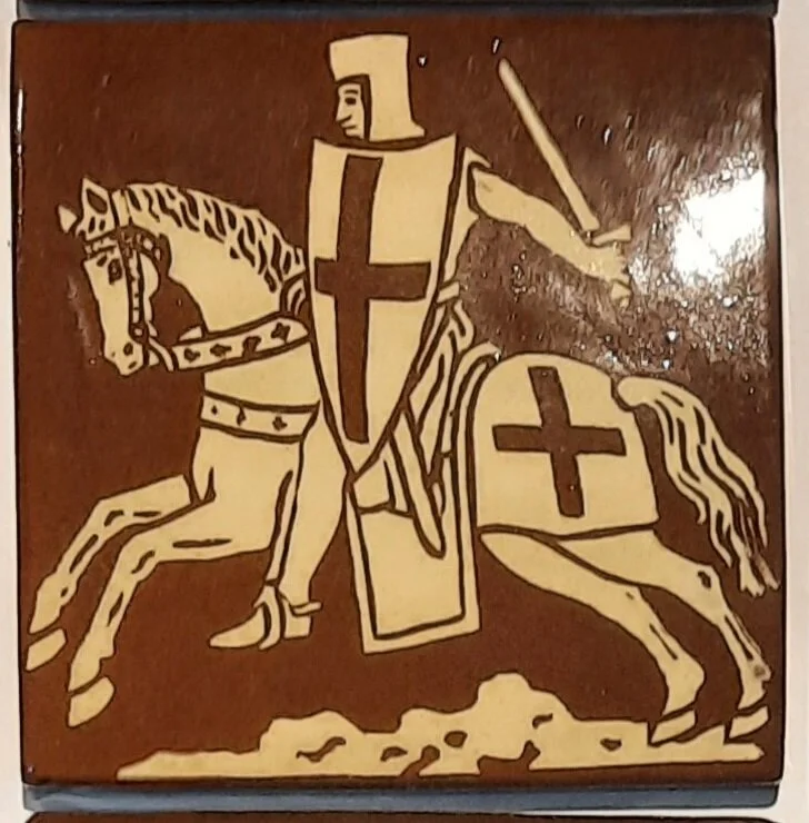 This tile is in Temple Church in London and I think the current ones are Victorian copies of the original medieval tiles. 
