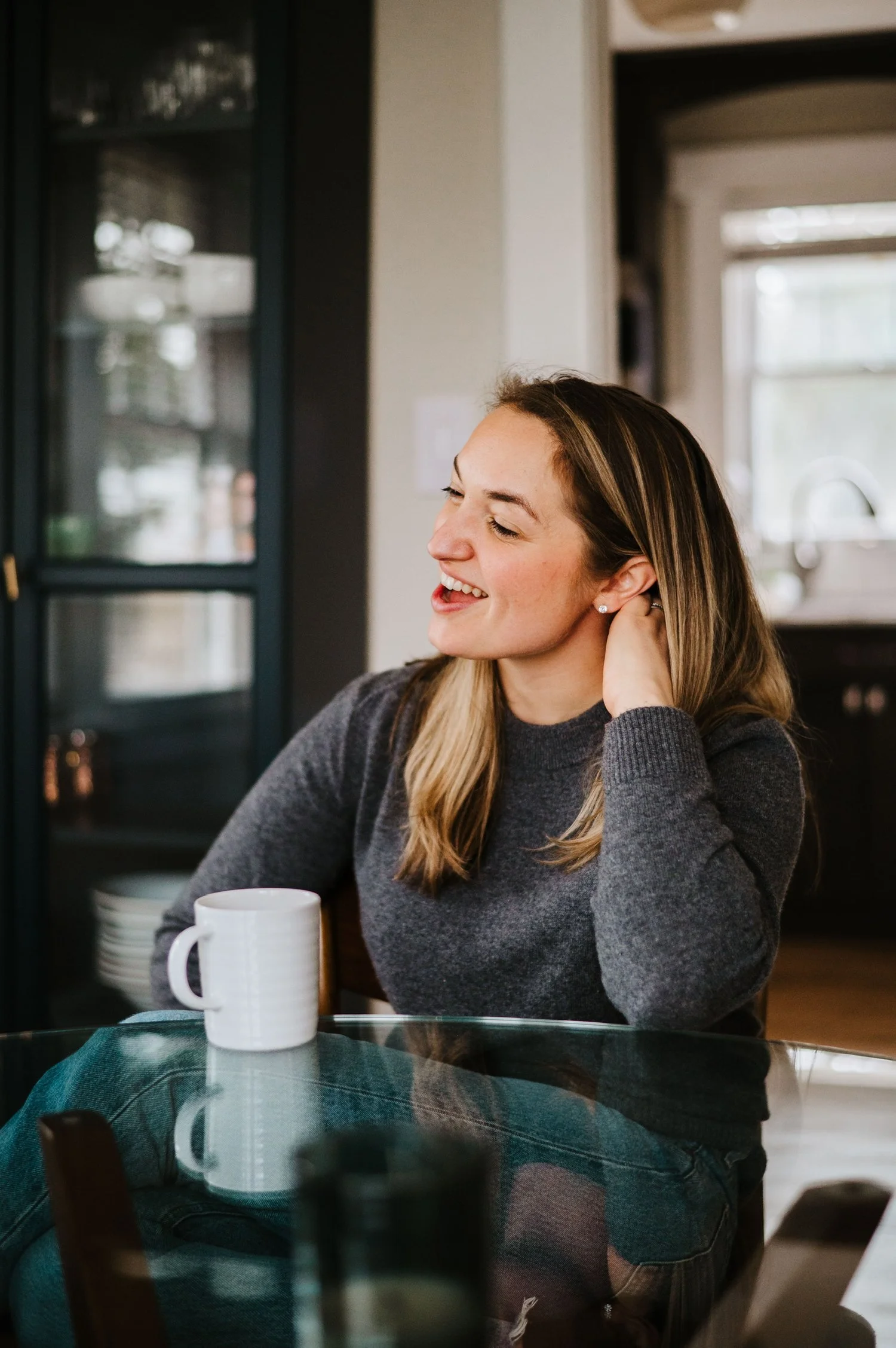 A branding photo of a woman at her home