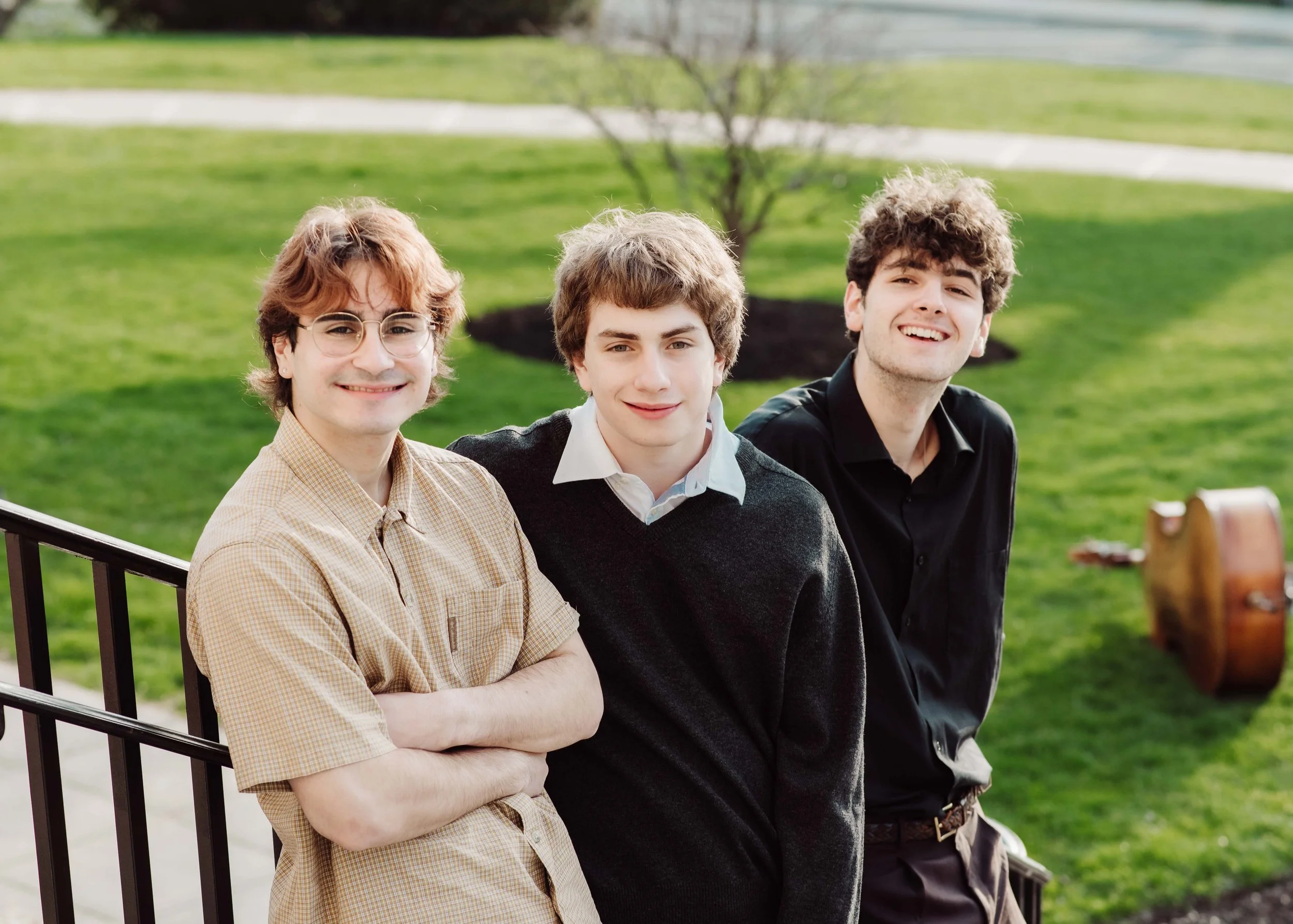 Three senior highschool boys smiling