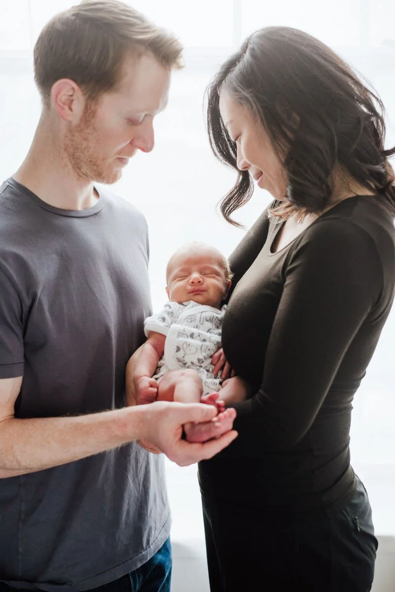 A couple with a newborn baby 