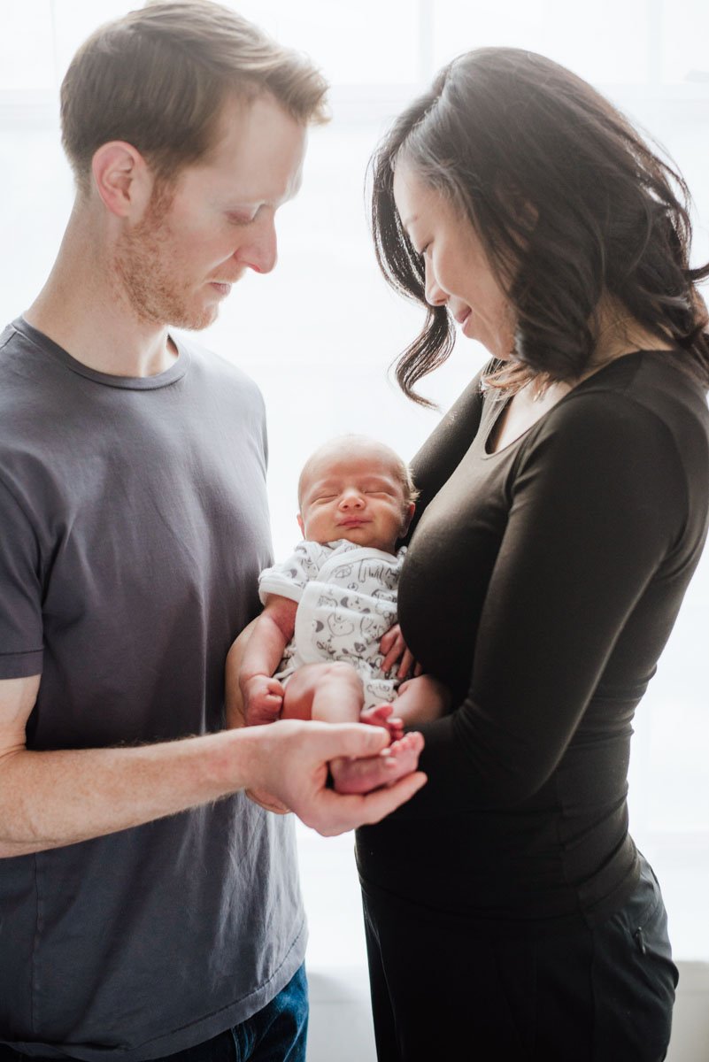 A couple with a newborn baby 