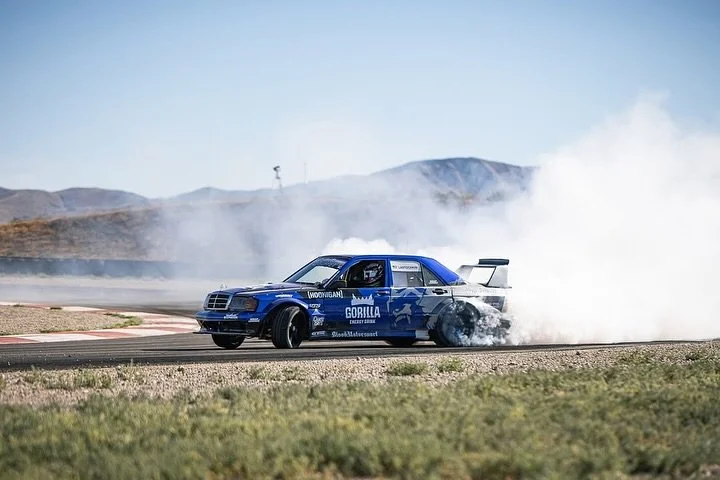 New look, same smoke. We installed the latest @gorillaenergy inspired livery on @nikitagoesracing 190E drift car, built by the legends at @bloodmotorsportgarageusa . Caught in action at Drift Buffet in Grantsville, Utah. Clean lines, loud style, and 