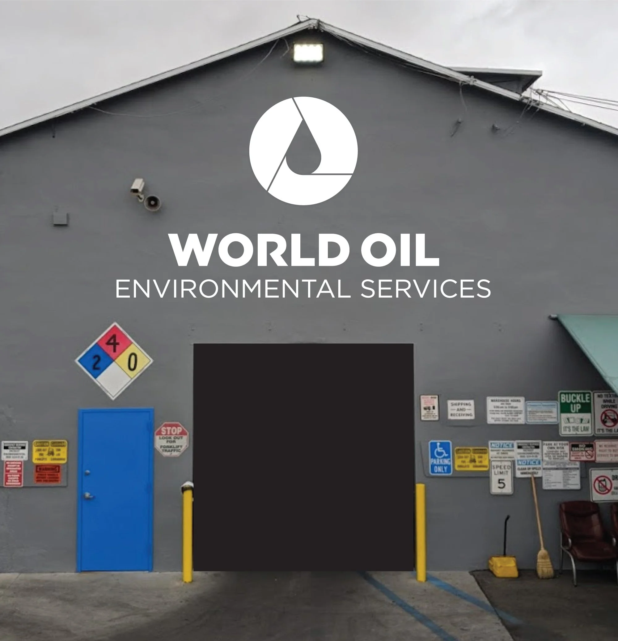 A laptop screen displaying a graphic design program with the logo "World Oil Environmental Services" in a warehouse setting. In the background, a large white truck trailer and various equipment are visible.