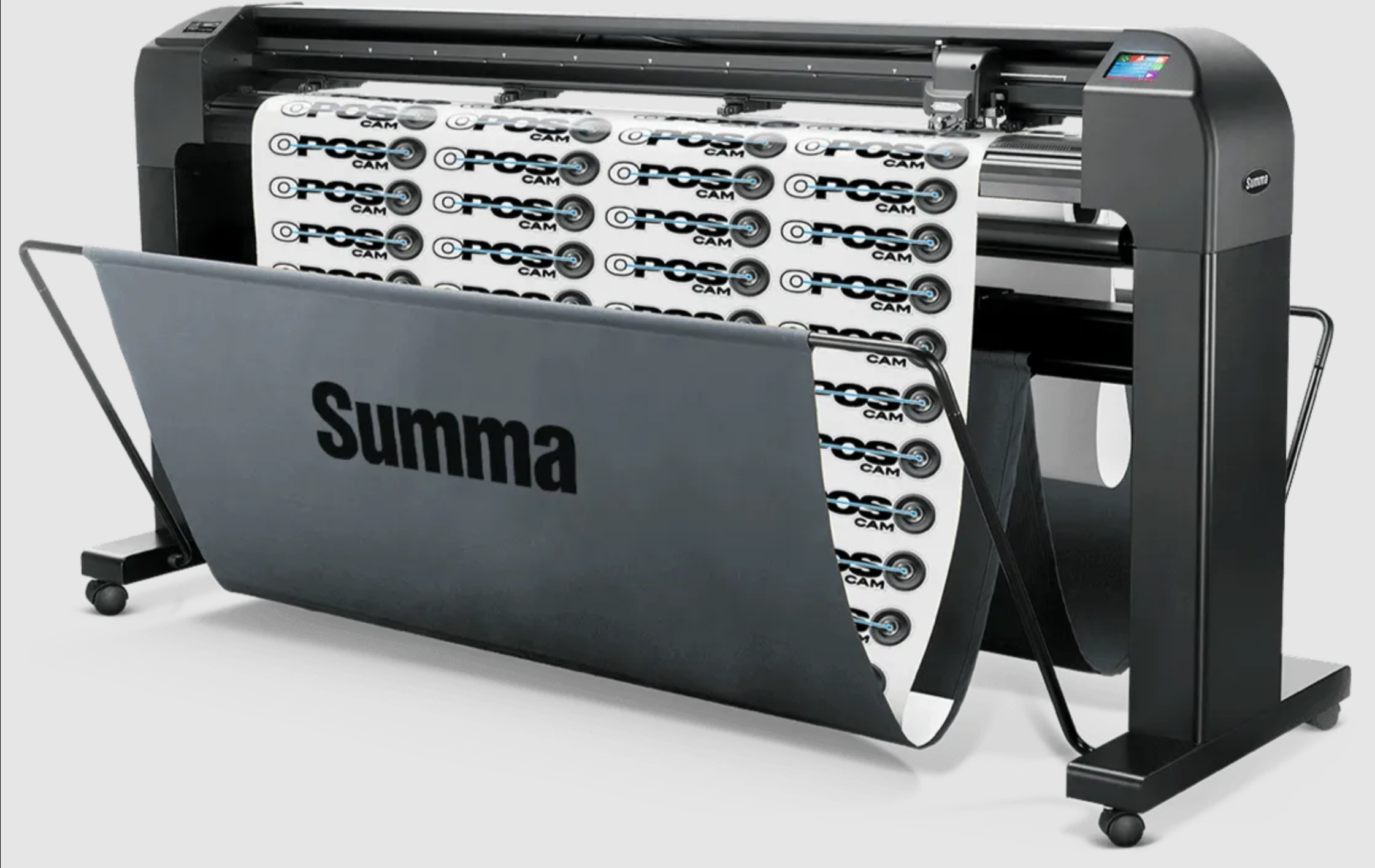 Large-format vinyl cutter by Summa with printed vinyl rolls.