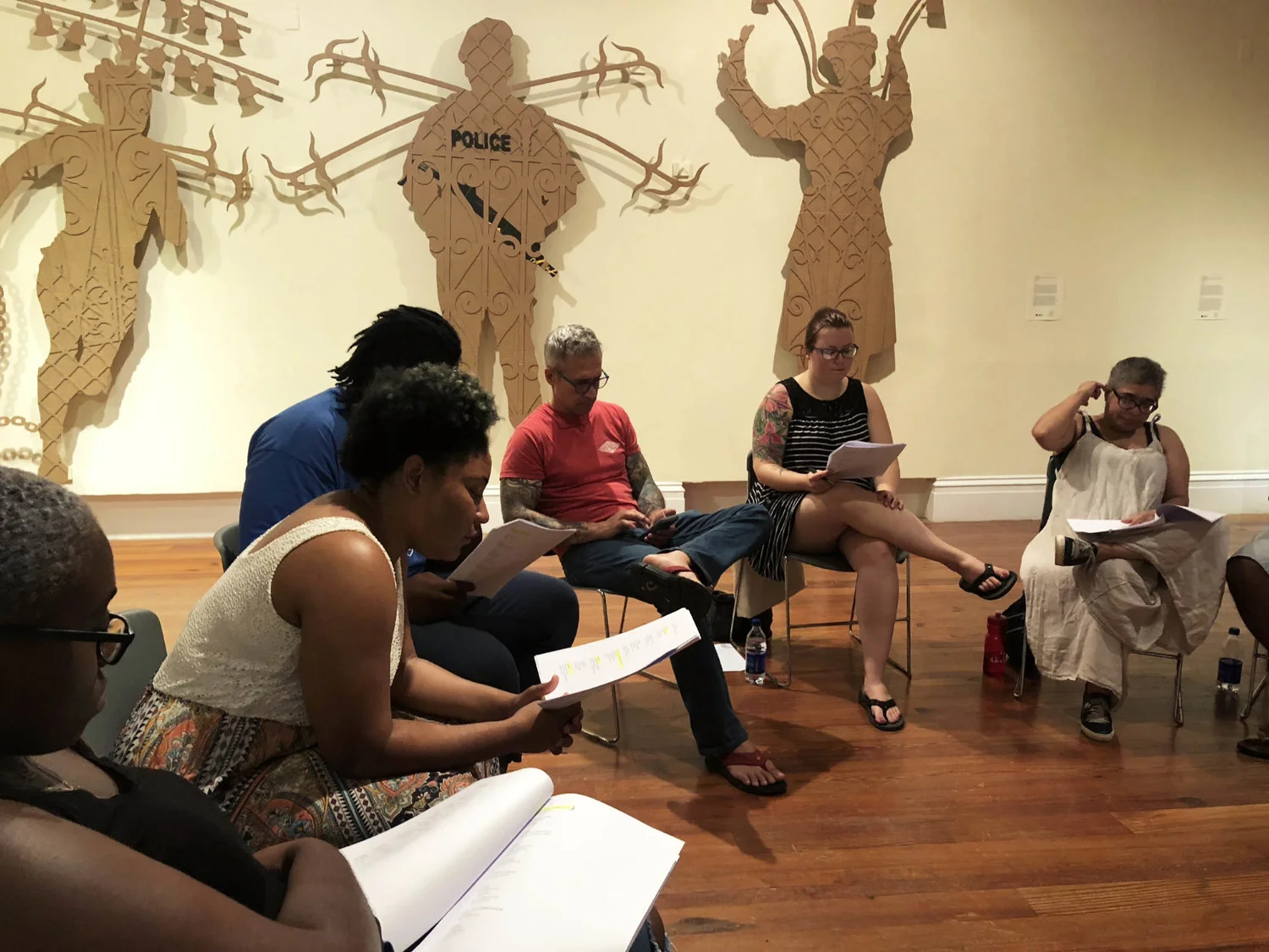 The group of readers and performers practicing for the performance of “A True and Exact History”.