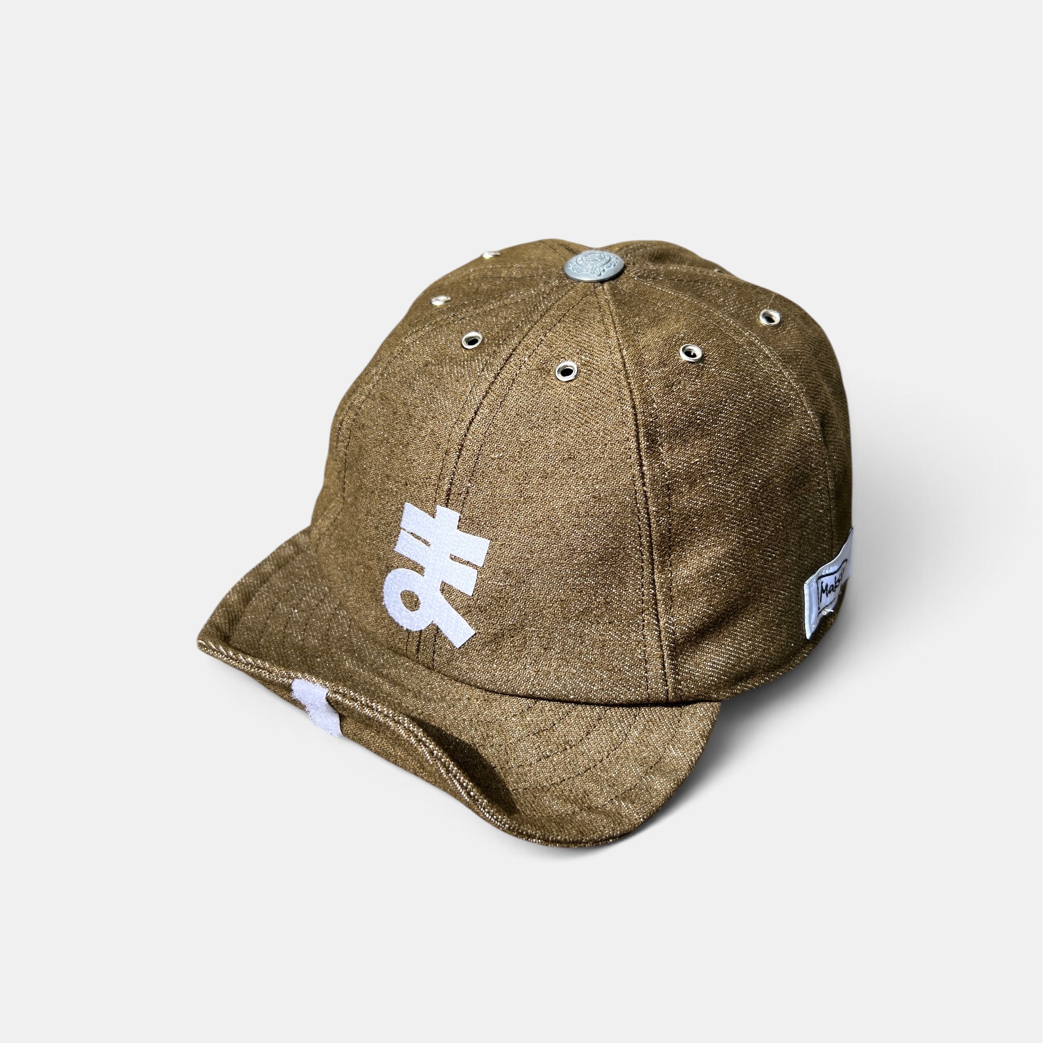 Olive-brown cotton denim eight-panel cap with white personalised velcro motif and roll-up wired visor