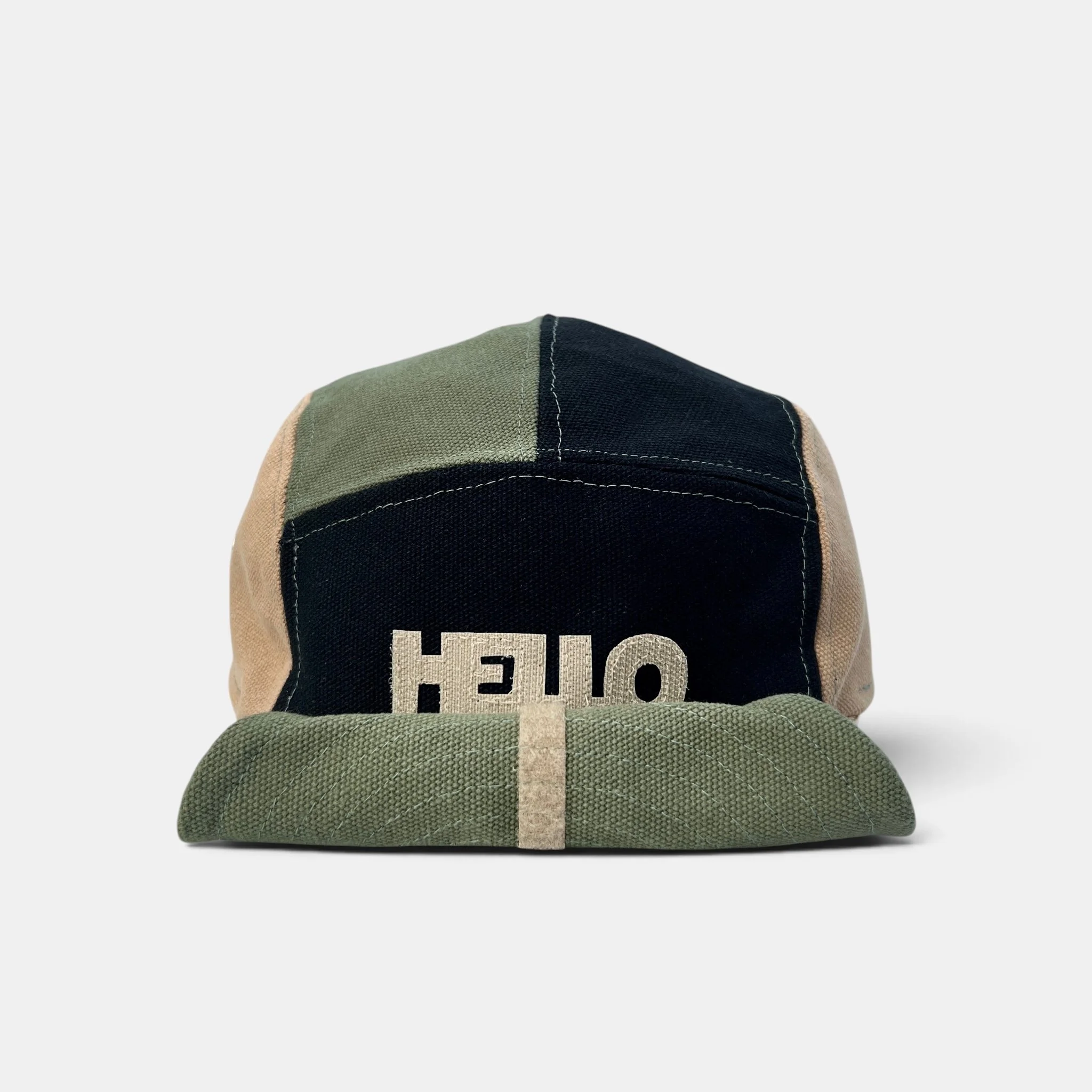 Olive, black and beige five-panel canvas cap with beige HELLO motif and rolled-up wired visor.
