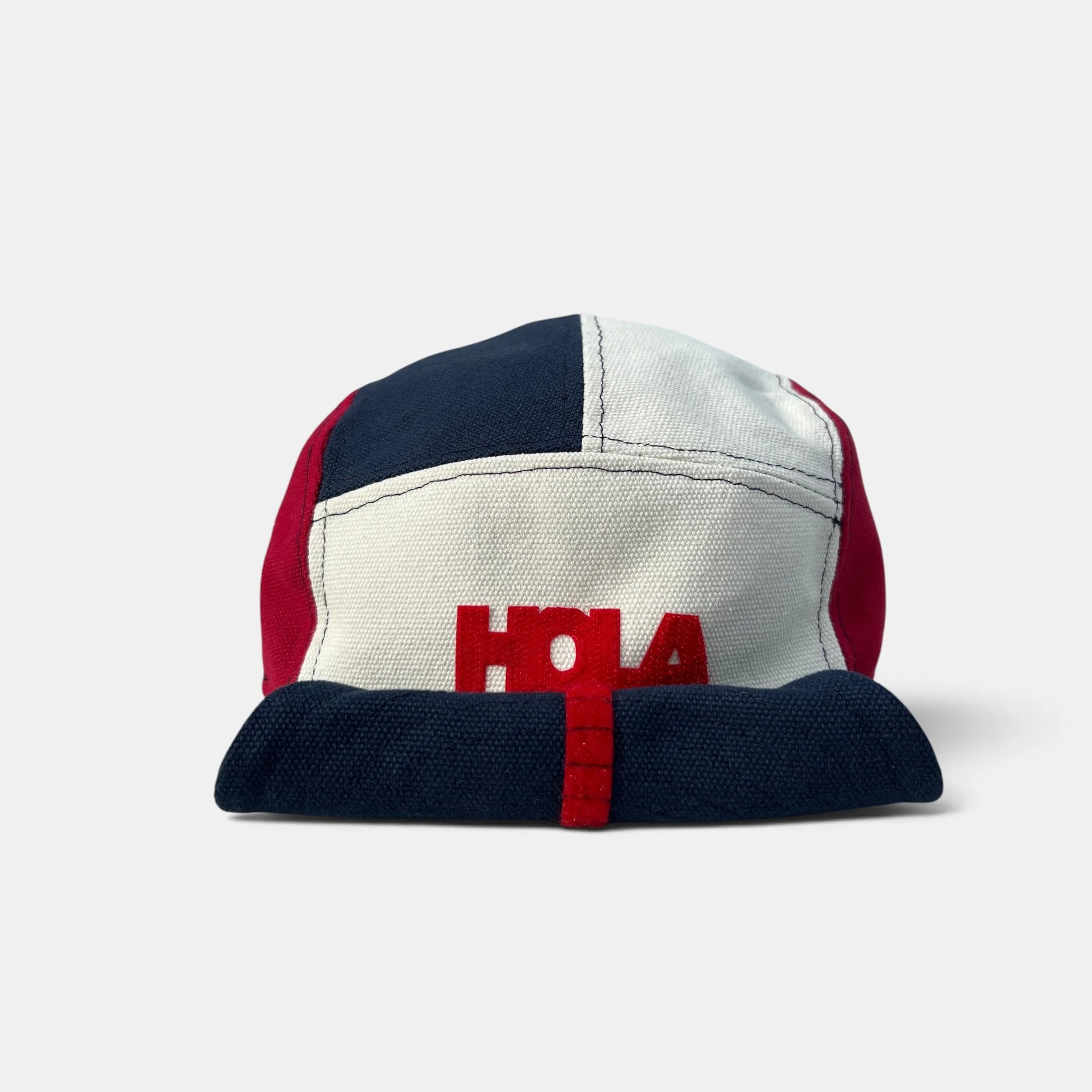 Red, navy and off-white five-panel canvas cap with HOLA motif and rolled-up wired visor.