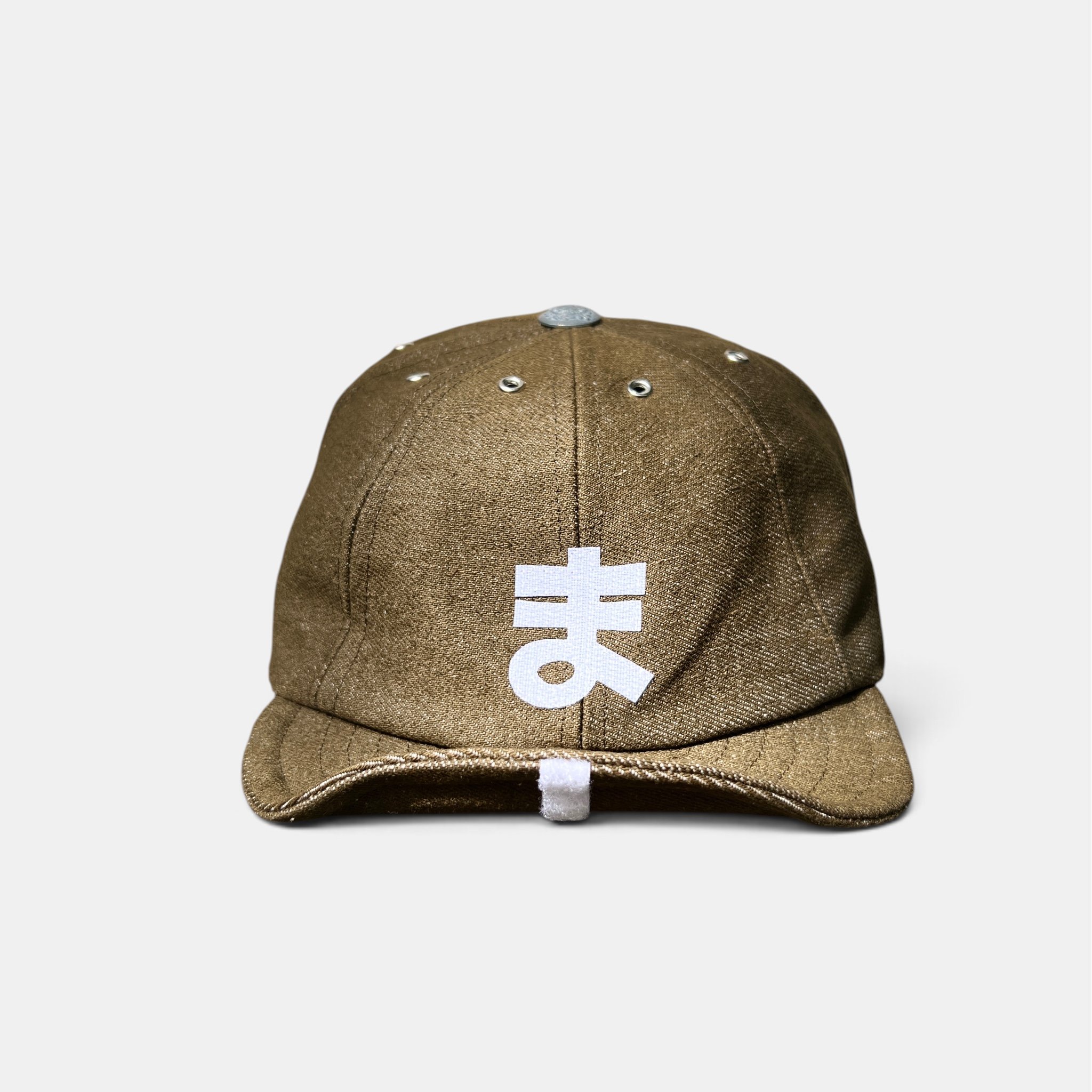 Front view of olive-brown cotton denim eight-panel cap with white personalised velcro motif