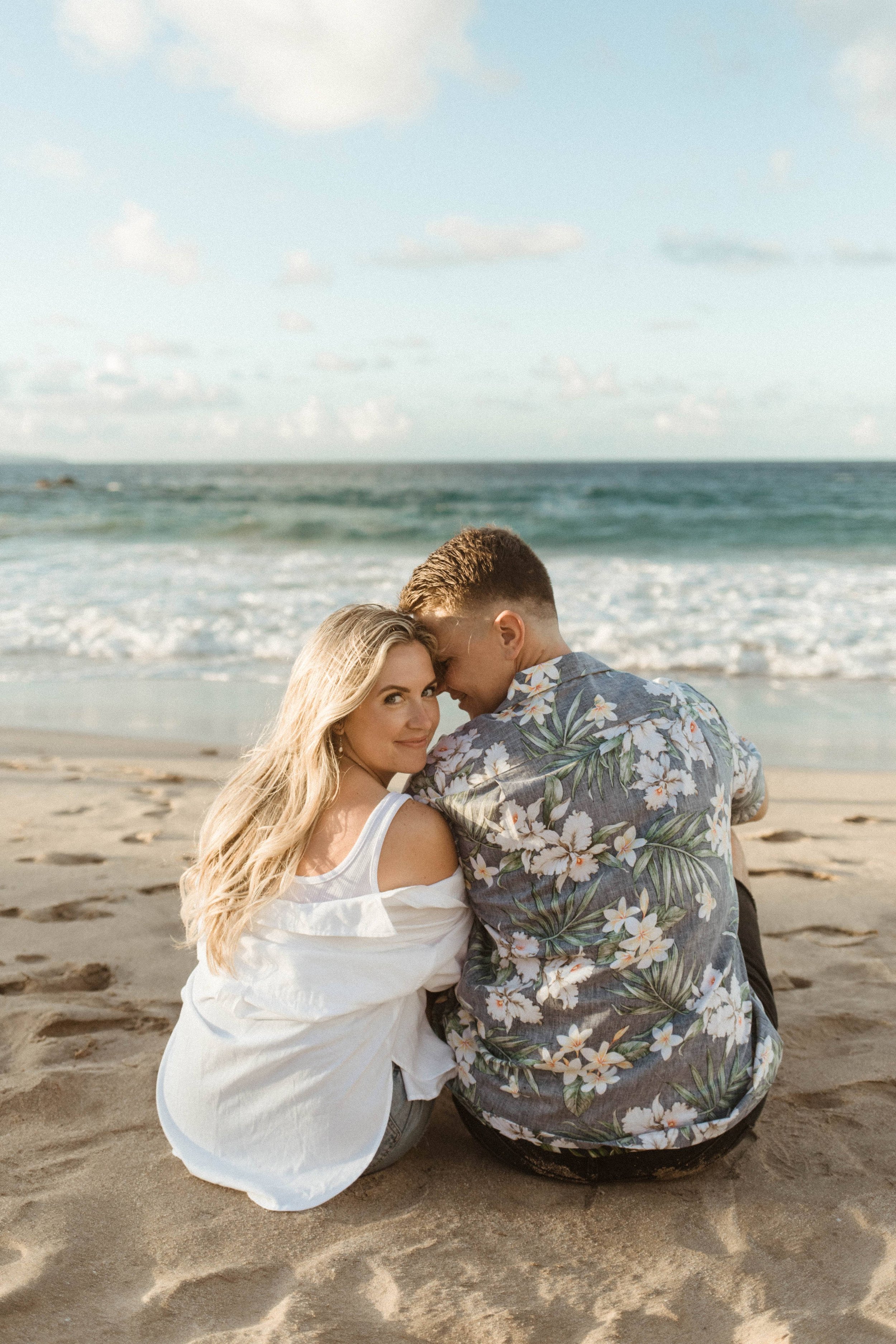  Couple sitting side by side on their couples photoshoot 