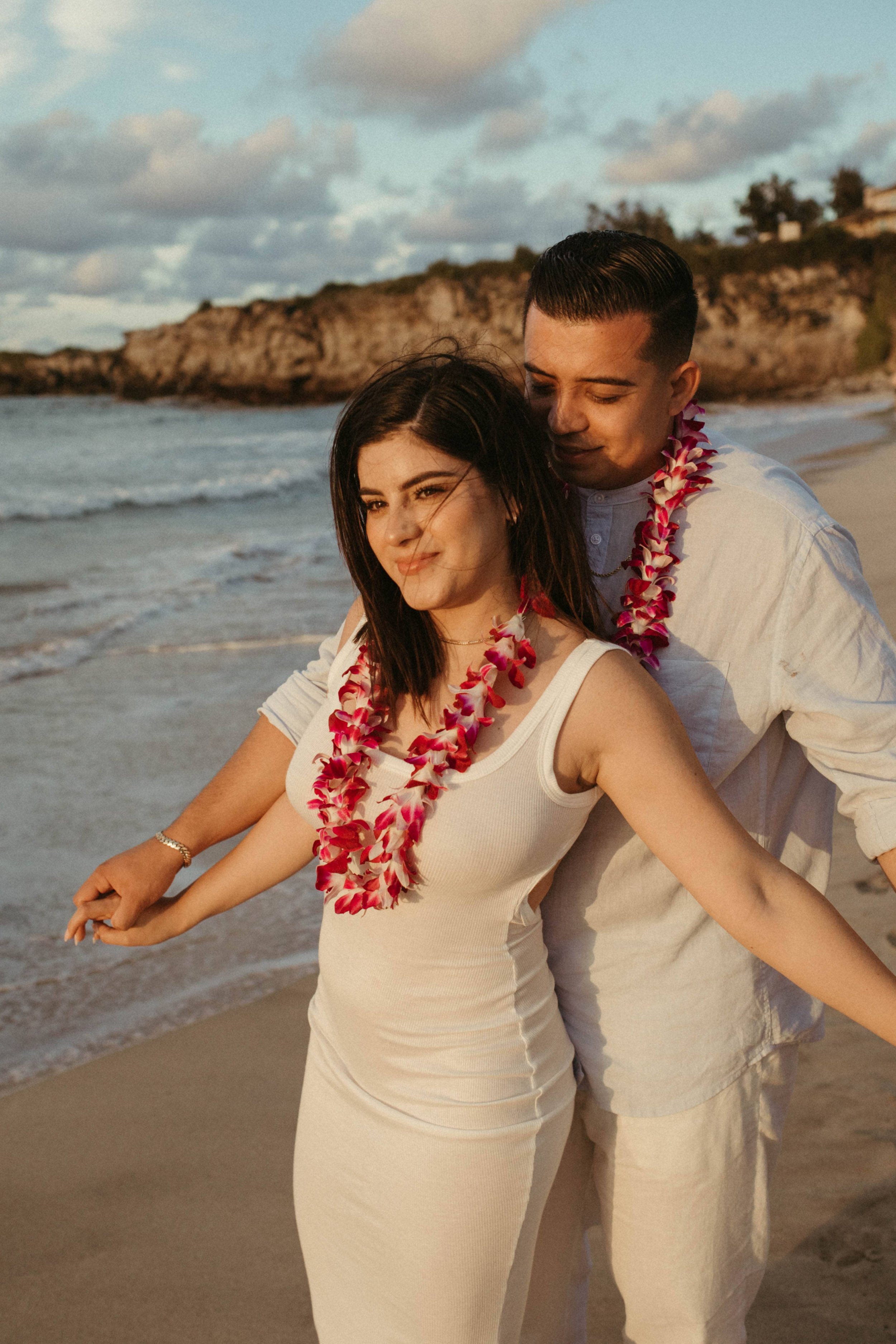  Couple doing the airplane pose, one of the best couples photoshoot poses that gets couples to interact and giggle  