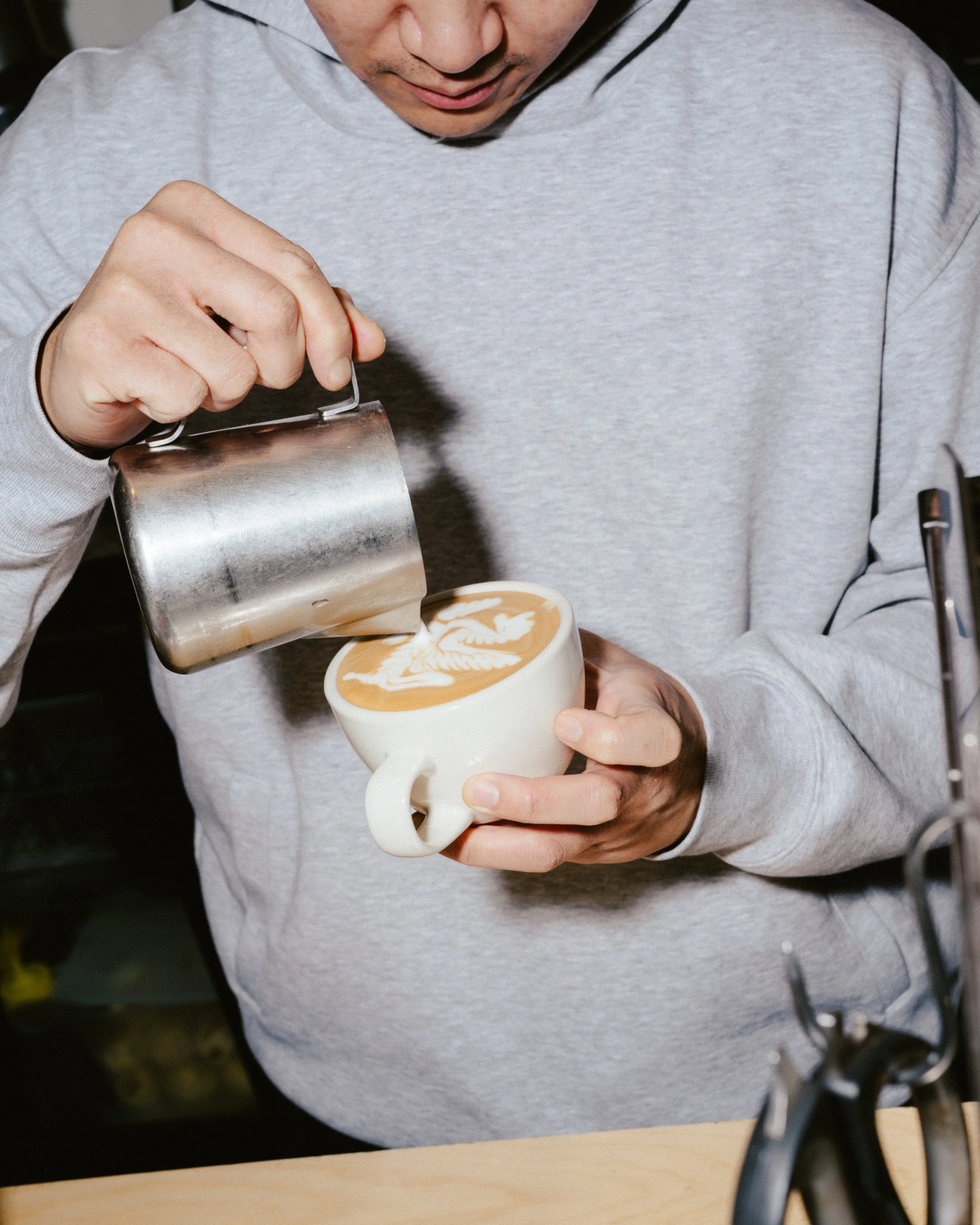 Serving specialty coffee at Ten Square cafe on Hardware Lane