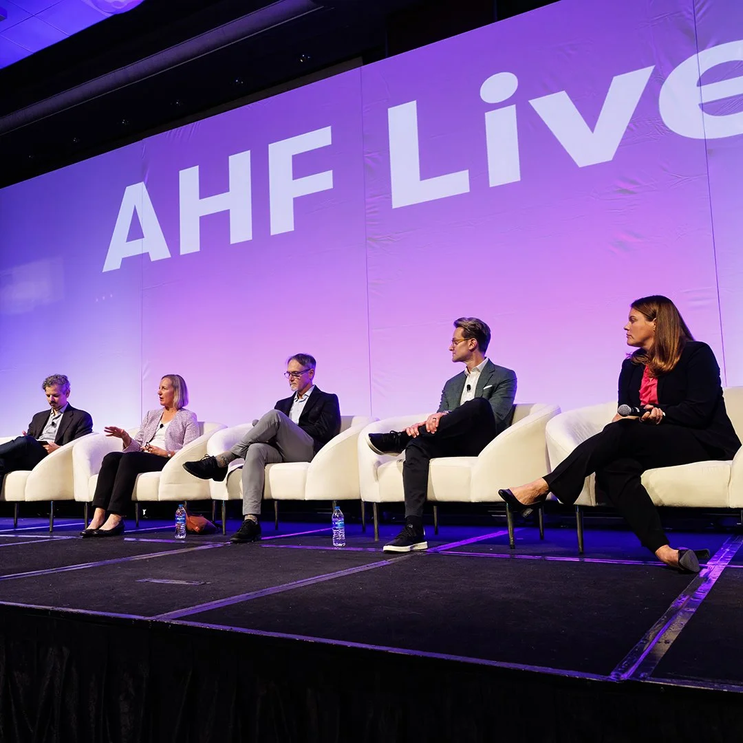 Image of panel participants on stage at Housing Finance Live event.