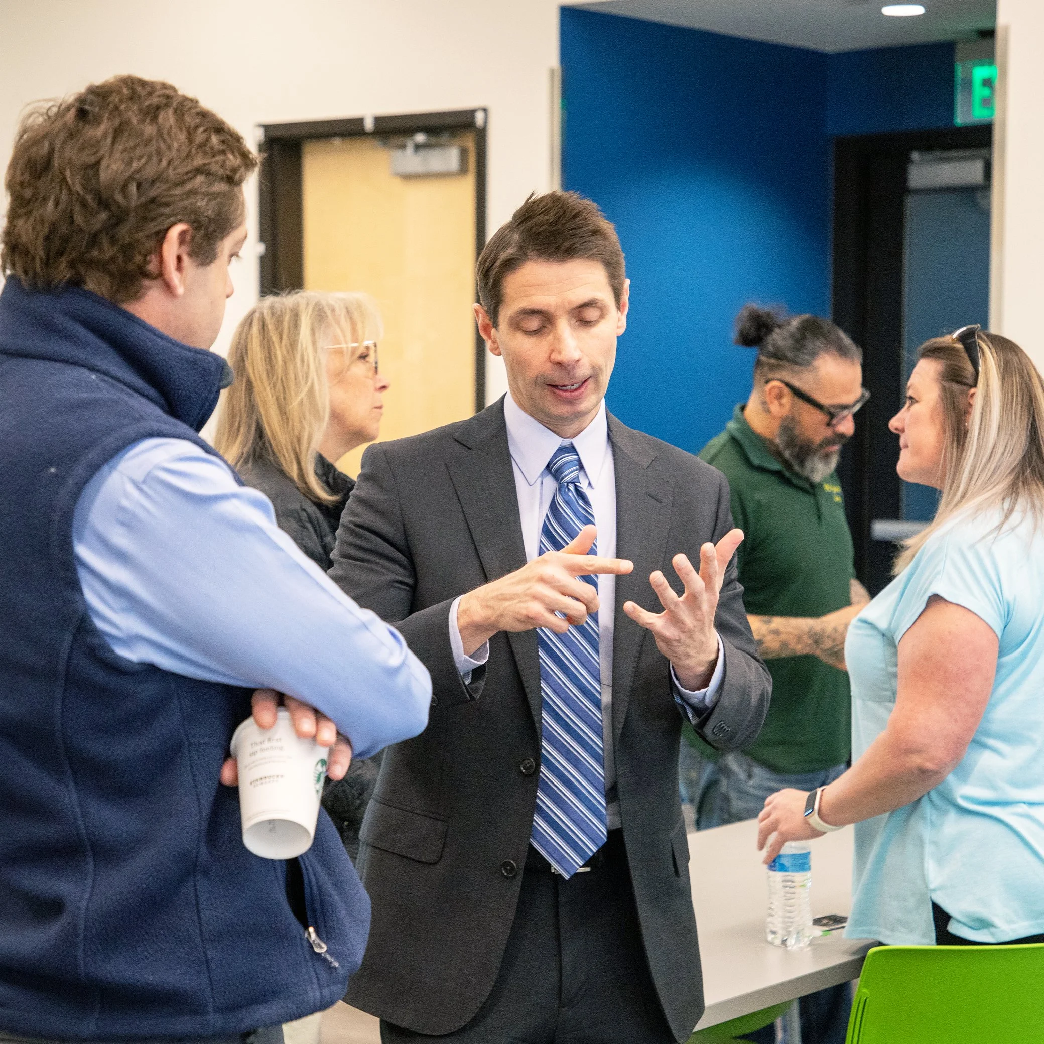 Image of Steve Boice, CHFA Manager, talking with people at event