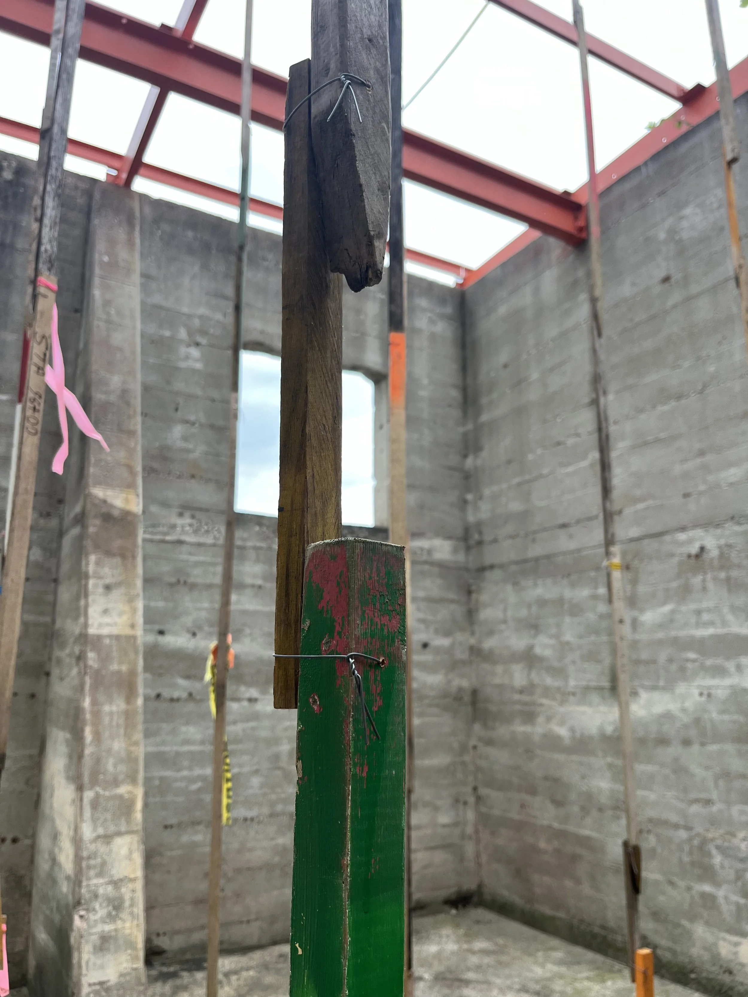 "Dead Creek Survey", found survey stakes and fencing wire, 2025. Installation for NON STNDRD at the National Building Arts Center, St. Louis. Photo by Bruce Burton.