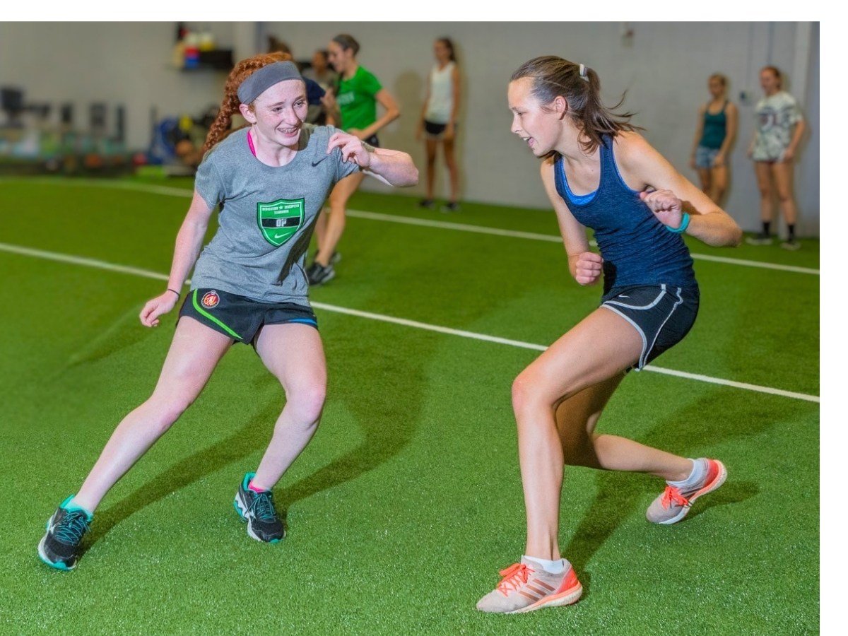 Female youth athletes training speed, agility, and lateral change of direction at The Spot Athletics in Dublin, Ohio