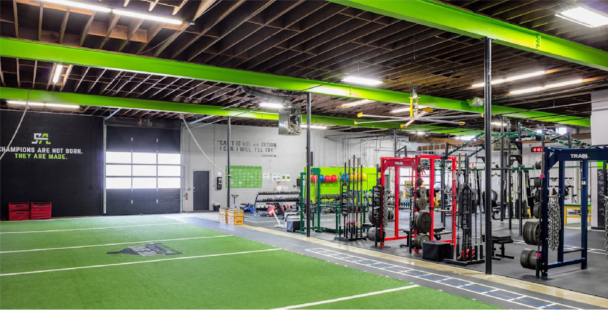 Inside The Spot Athletics Grandview, Ohio gym with weight racks and turf field