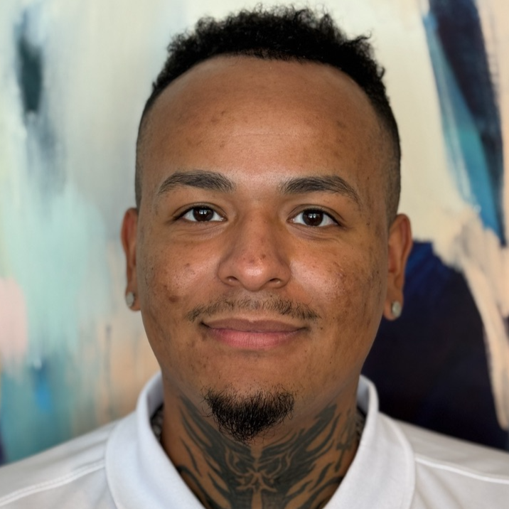 Logo for Helio Greentech with a stylized sun and a sprouting plant inside a circular design.