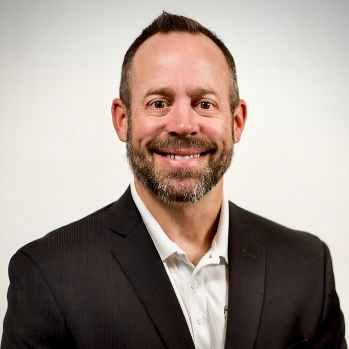 Helio Greentech logo with a stylized icon of a rooster's head surrounded by green sun rays.