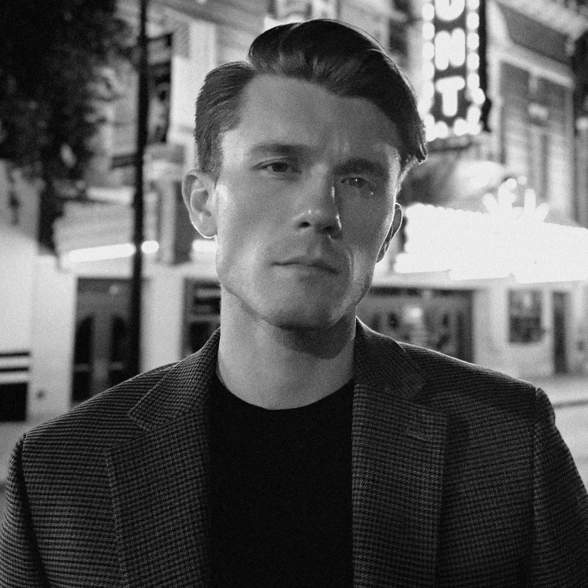 Logo for Helio GreenTech featuring a stylized goat inside a sun with green rays.