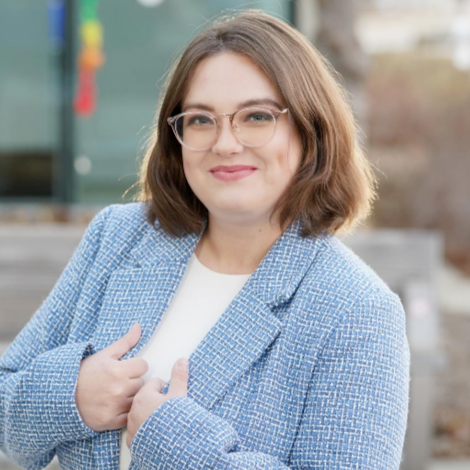 Logo for Helio Green Tech with a stylized leaf and sun design.