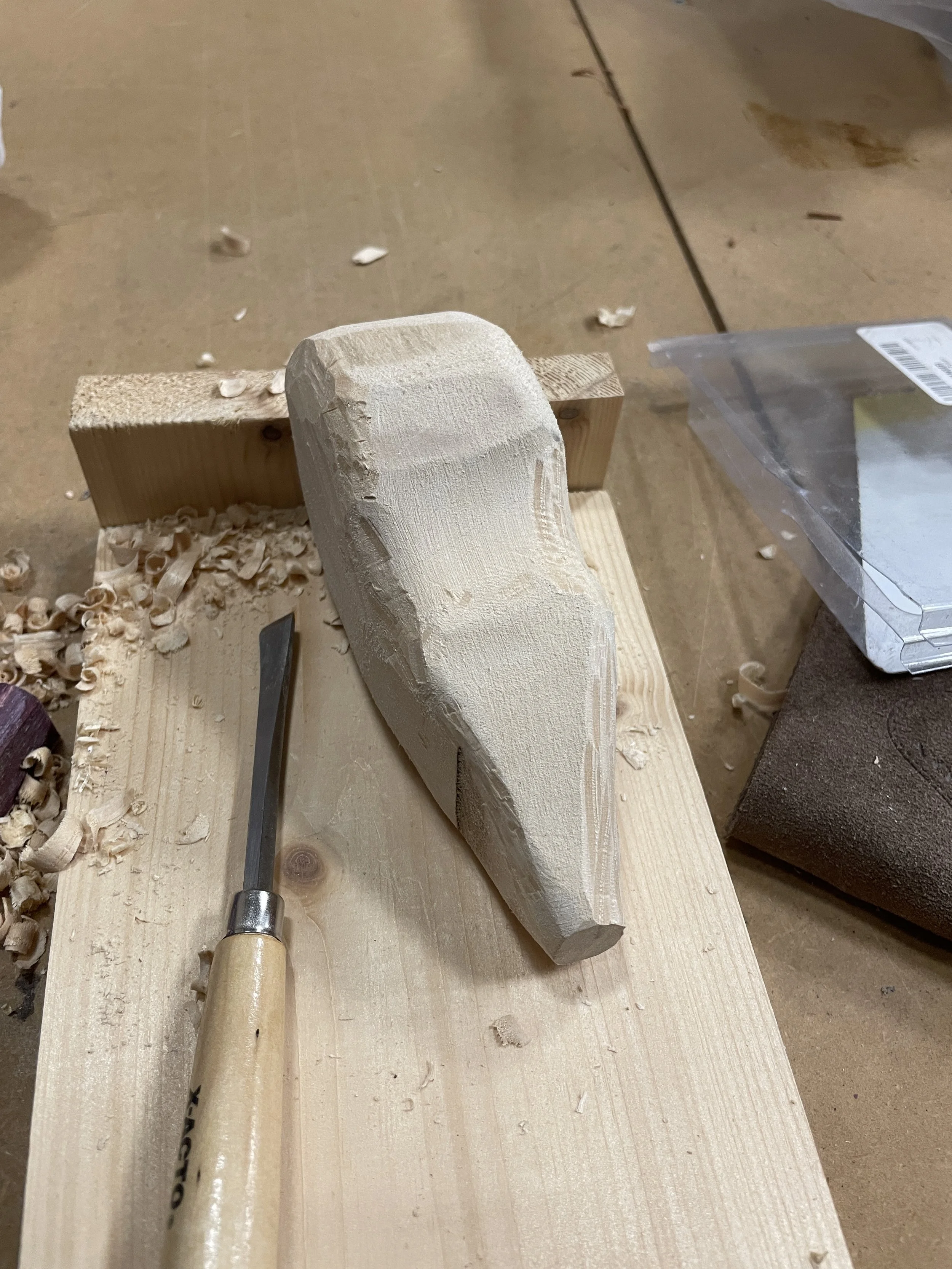 Process shot of whittling thigh piece