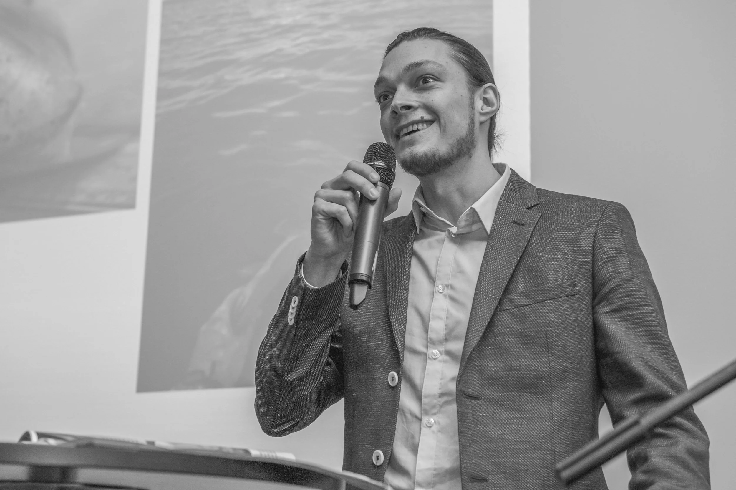 Conservation photographer and filmmaker Tom Vierus speaking at a public event.