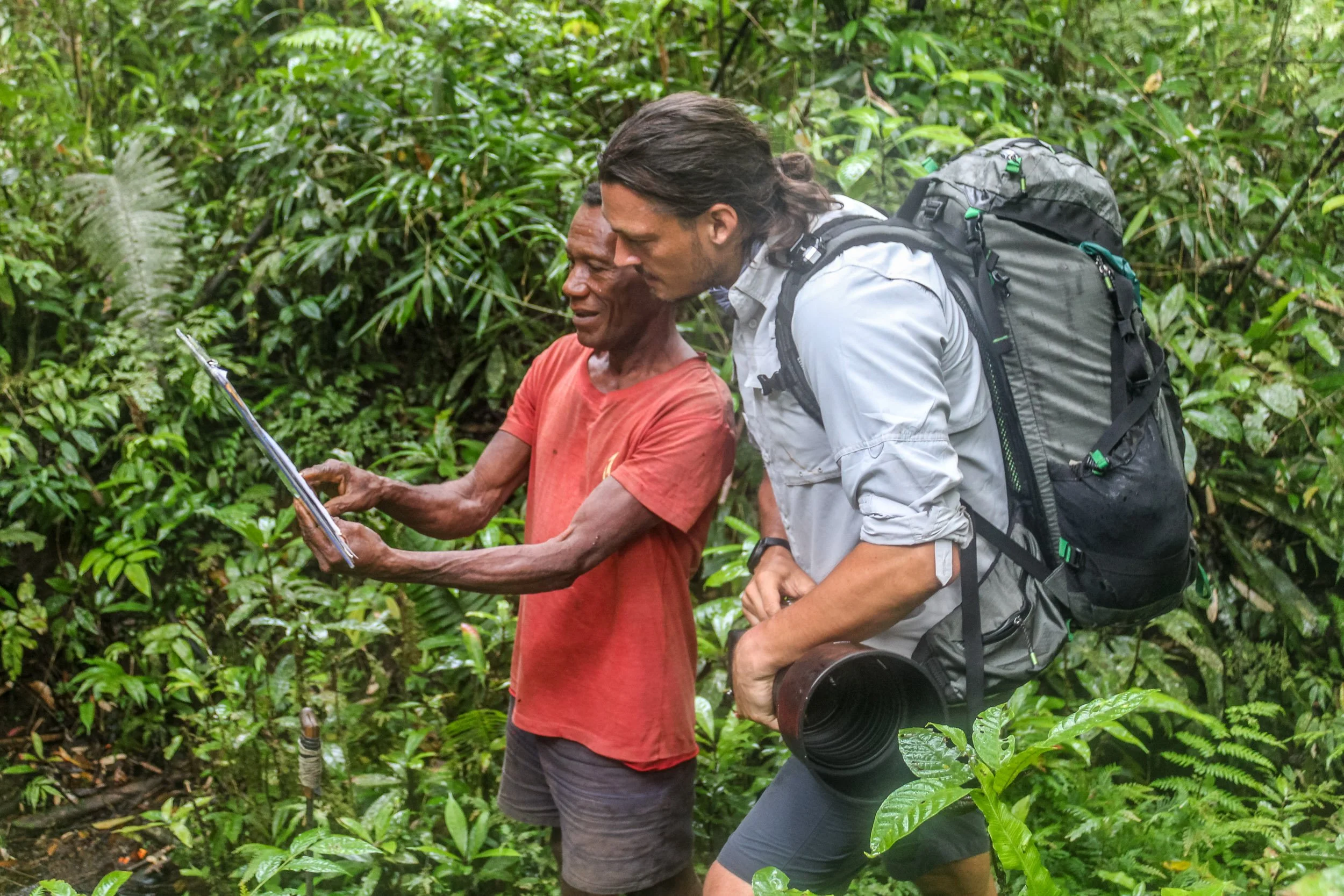 Tom Vierus birding with a local guide in the rainforest of Pomio, East New Britain, Papua New Guinea.