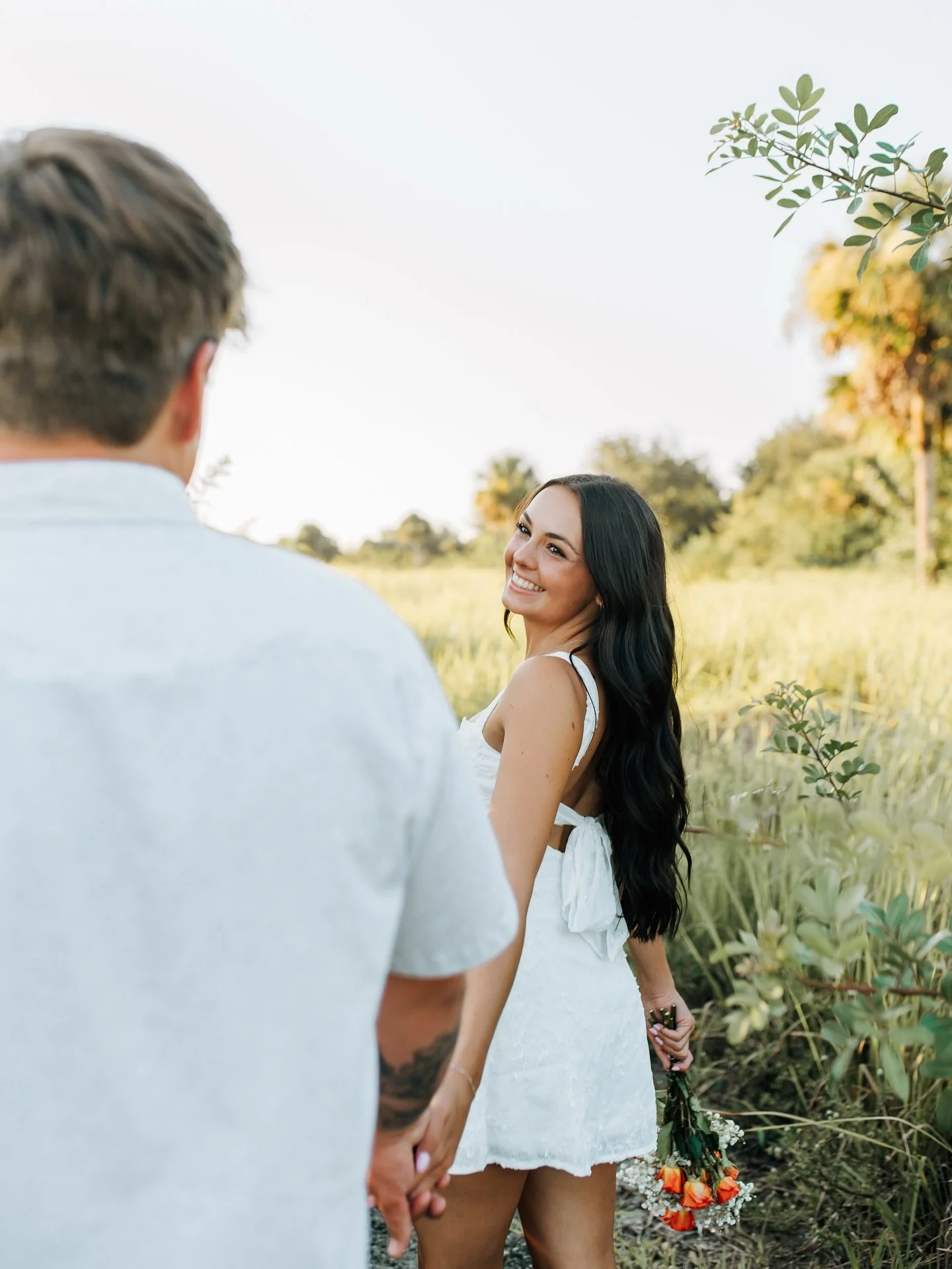 Alexa, you&rsquo;re pure sunshine. Parker&hellip;your job? Keep her smiling. ☀️ 🫶🏻😊
.
.
.
.
.
.
.
.
.
.
.
.
.
.
.
.
.
couples photography melbourne florida, brevard county couples photographer, florida engagement photos, field couples session, can