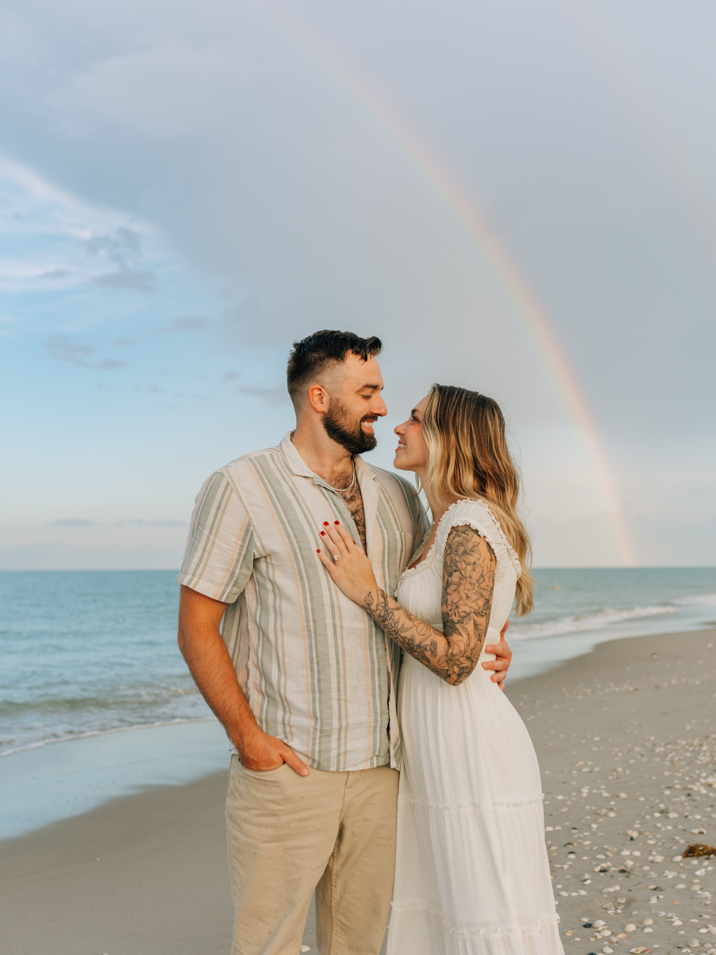 That time the most perfect rainbow appeared during Hailey + Shane&rsquo;s engagement session. 🌈 ❤️ 
.
.
.
.
.
.
.
.

🏷️ Melbourne Florida couples photographer | Space Coast couples session | beach couples photos | rainbow beach session | Melbourne 